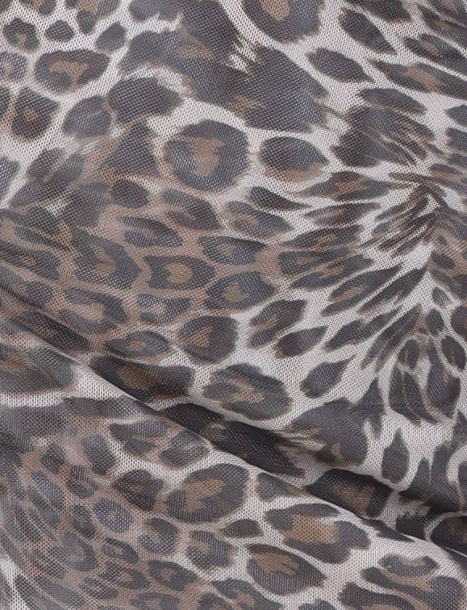 Close-up of the CAMPBELL MINI DRESS - NEUTRAL: LEOPARD by TIGERMIST, showcasing its high-stretch fabric with a leopard print pattern. The design features spots in shades of brown and black on a light beige background. The fabric appears to be slightly gathered, exhibiting a mesh-like texture.