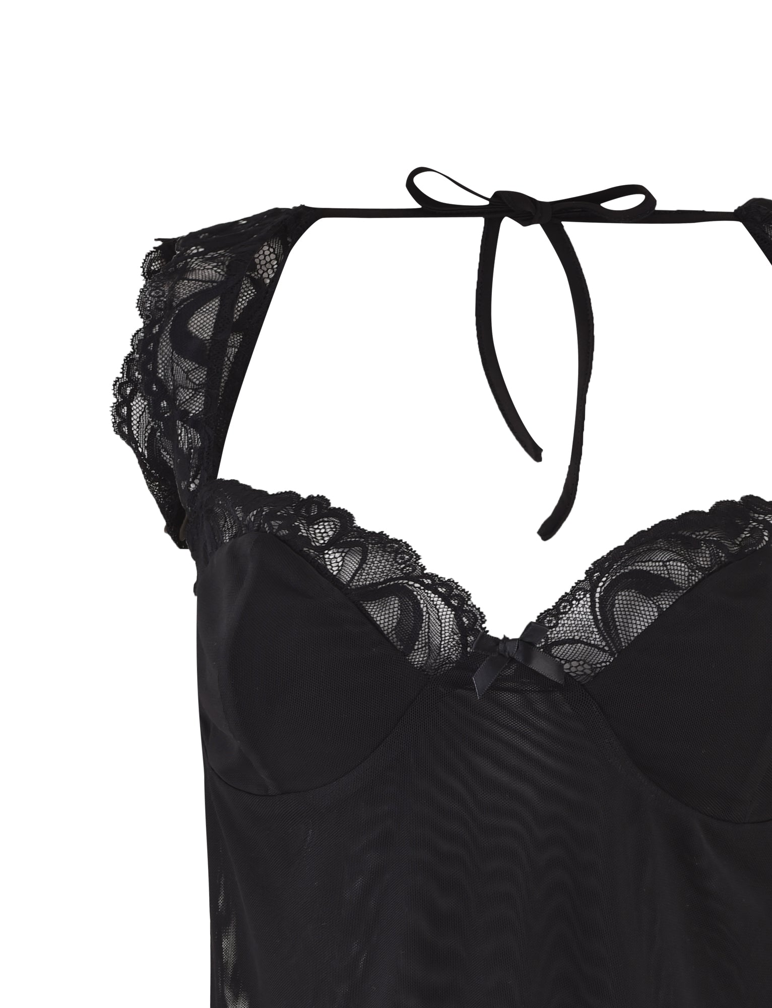 Introducing the NYOMI TOP - BLACK by TIGERMIST, showcasing intricate lace detailing on the shoulders and bust. This top features a charming bow at the neckline, is crafted from lightweight and slightly transparent fabric, and boasts an open back design with a tie closure.