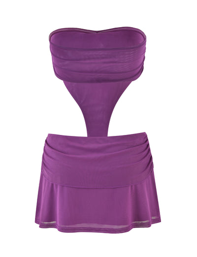A strapless, purple bikini with a distinctive design that includes a connected mesh middle section. The top is styled as a bandeau, while the bottom resembles a short skirt with ruching details at the waist. The sheer mesh middle offers a stylish look that evokes the aesthetic of TIGERMIST's iconic Kynlee Mini Dress - Purple.