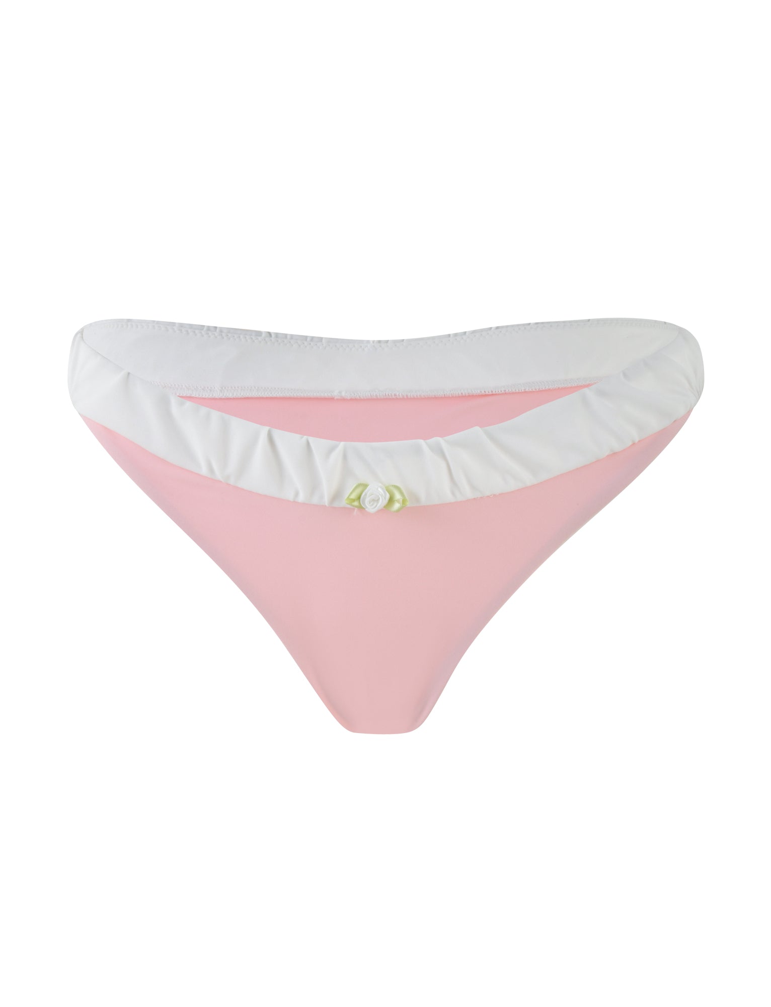 The AMARAN BIKINI BOTTOM in pastel pink from TIGERMIST features a playful design with a white ruffled waistband and a small decorative flower at the front center.