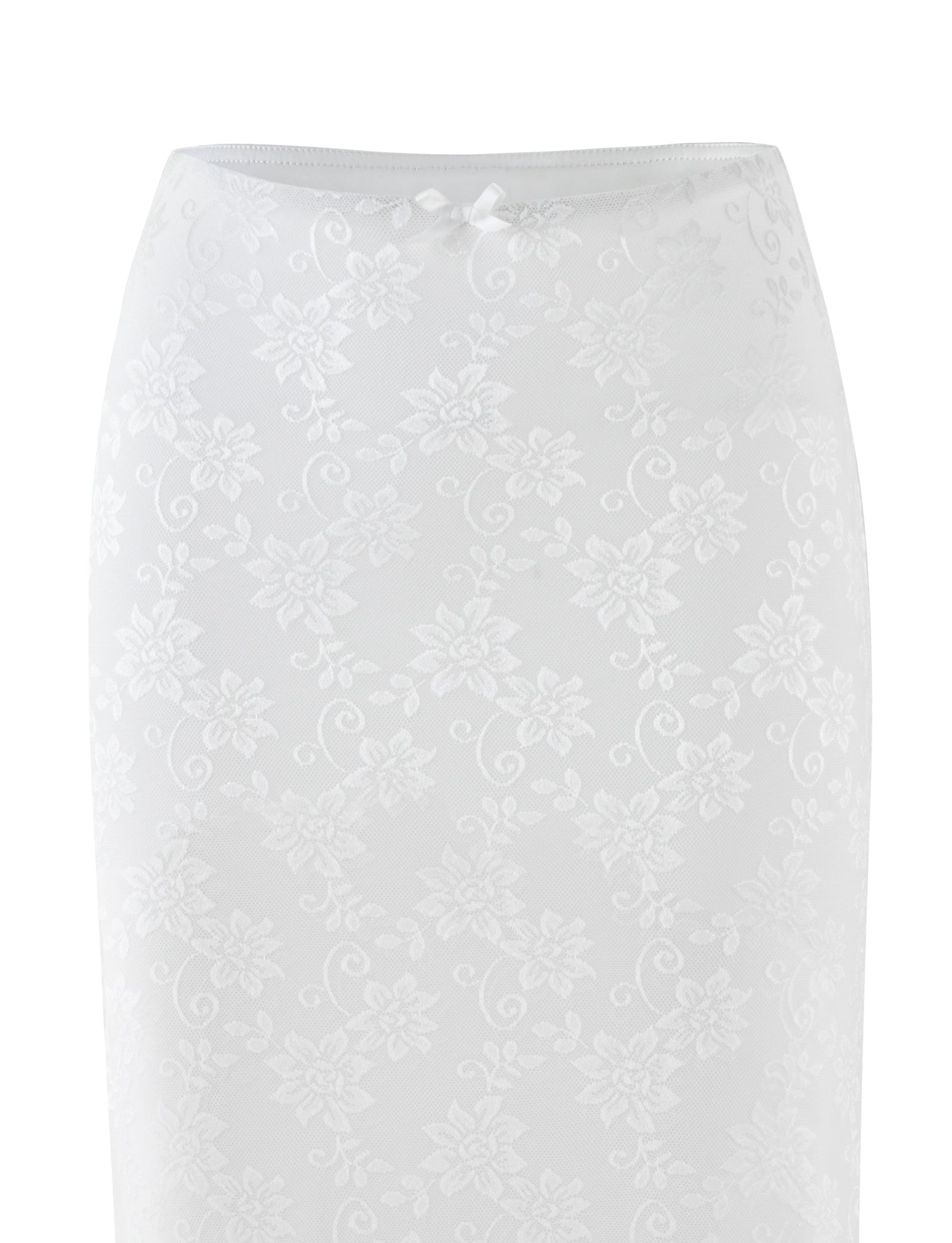 The CHARLEIGH SKIRT - WHITE : LACE by TIGERMIST is an elegant white lace pencil skirt featuring a low-rise waist and a floral pattern, accented with a subtle bow at the waistband. The intricate detailing imparts a delicate touch to its classic silhouette.