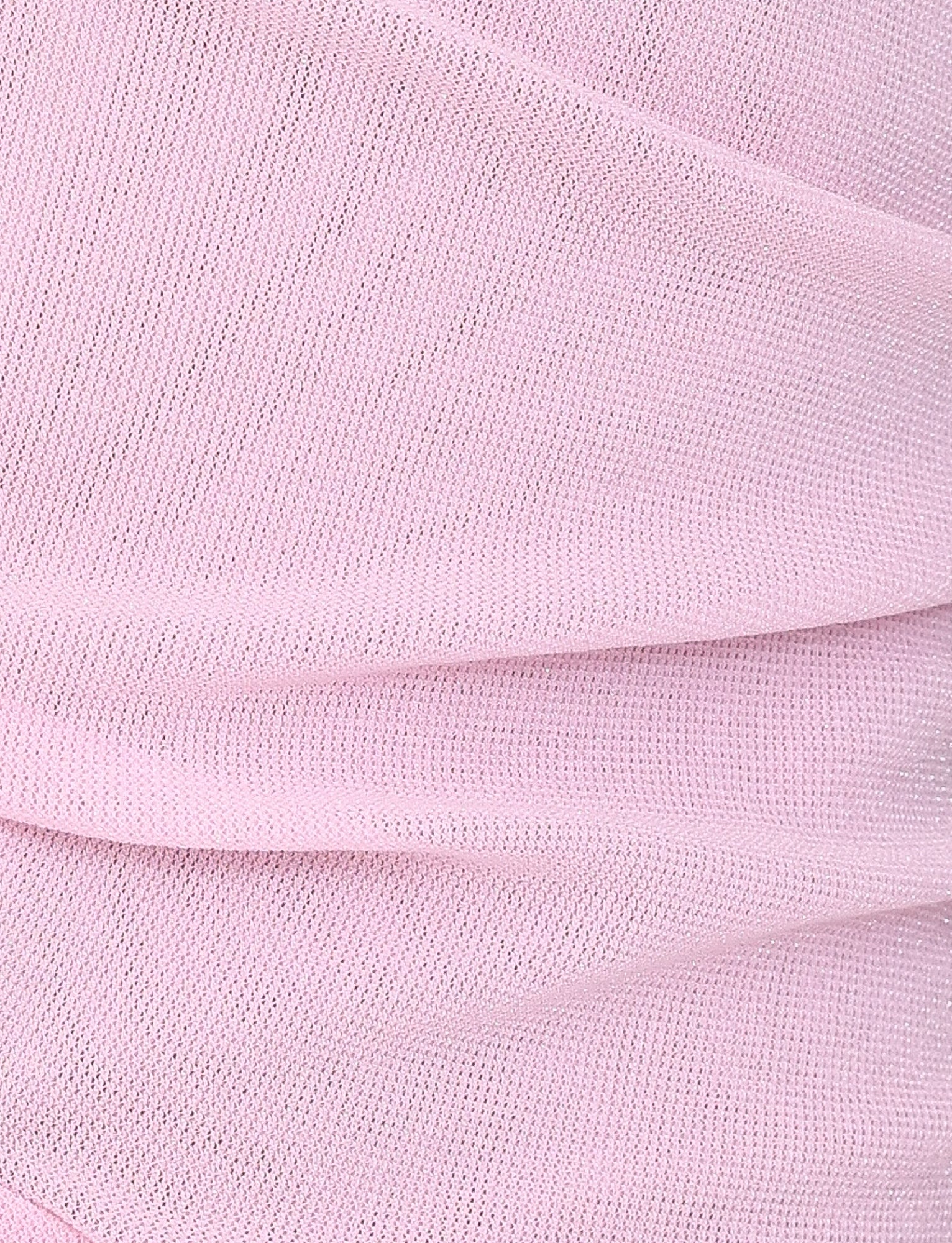 A close-up of the TIGERMIST COBI MINI DRESS 2.0 in baby pink highlights its soft fabric with subtle folds and a fine mesh texture, creating gentle undulations across the surface.