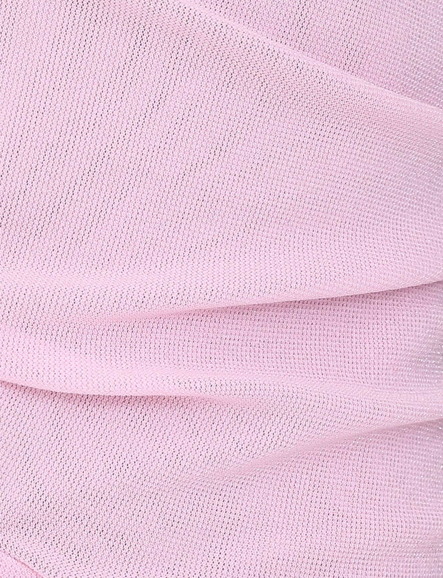 A close-up of the TIGERMIST COBI MINI DRESS 2.0 in baby pink highlights its soft fabric with subtle folds and a fine mesh texture, creating gentle undulations across the surface.