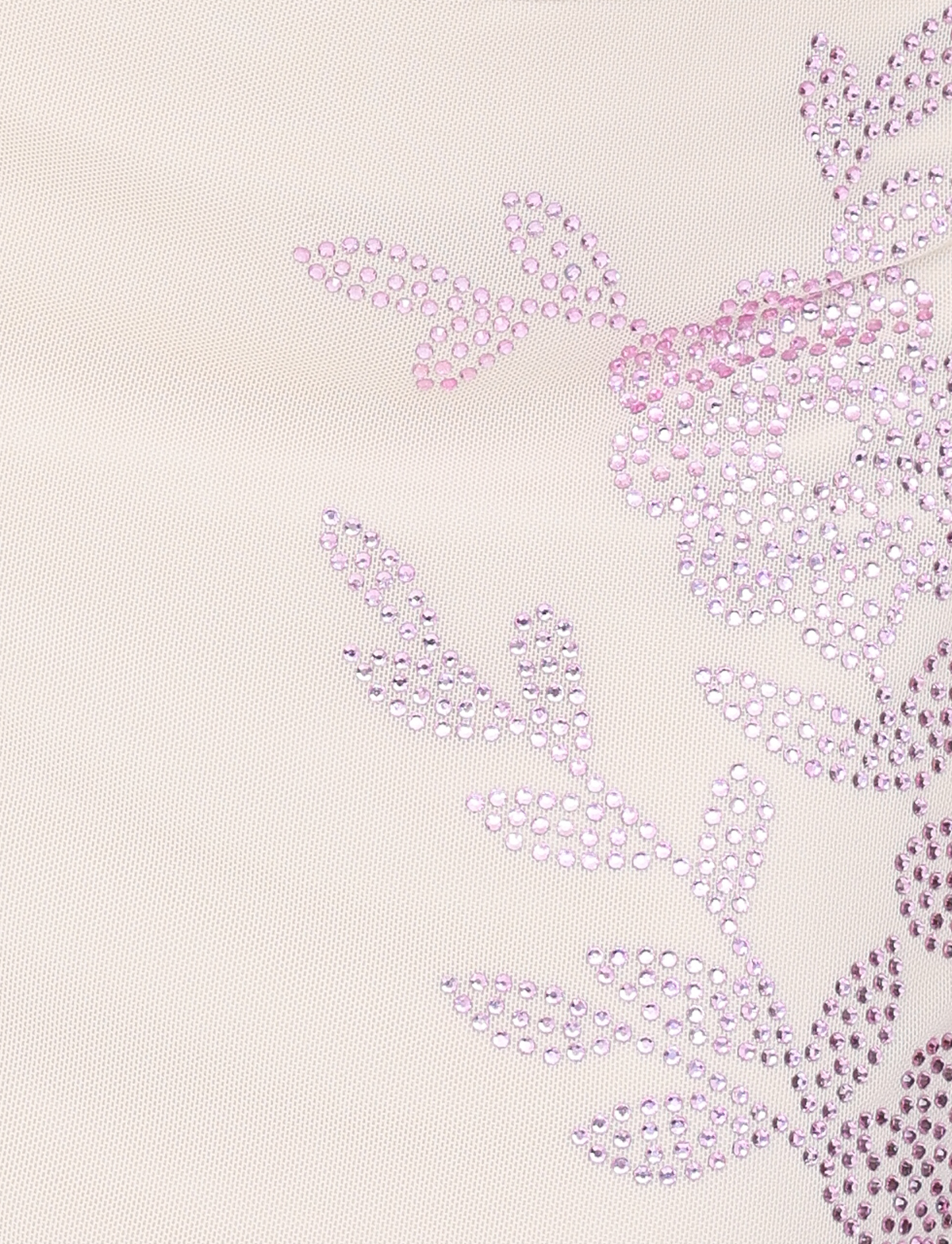 Close-up of the TIGERMIST OCTAVIA MINI SKIRT in cream, featuring light beige fabric with a decorative floral pattern of shiny pink rhinestones forming flowers and leaves on the right side.
