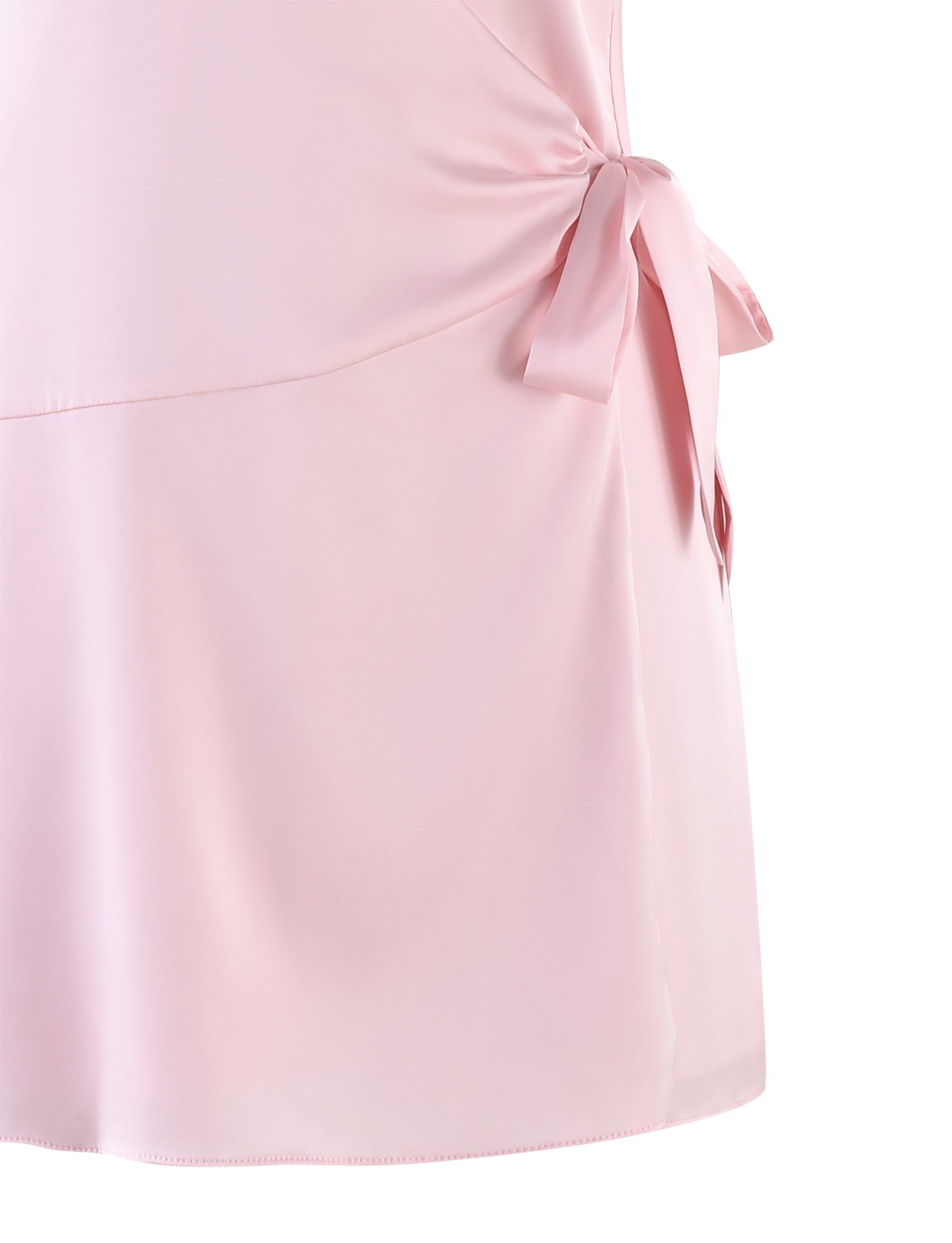 Close-up of the MONROE 2.0 MINI DRESS in pastel pink from TIGERMIST, highlighting a satin bow detail on the side. The fabric has a smooth and slightly shiny appearance with a soft drape, while the bow enhances this simple yet elegant design in its pink hue.
