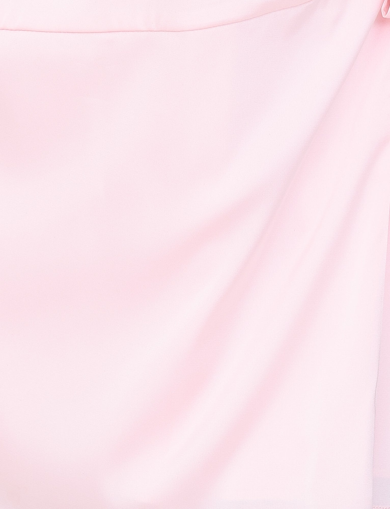 A close-up of the soft, pink fabric with gentle folds and draping evokes the smooth elegance of the Monroe 2.0 Mini Dress in Pastel Pink by TIGERMIST, creating an exquisite texture.