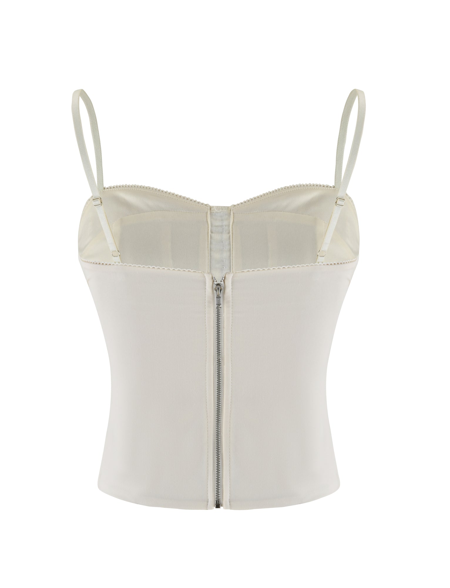 The TIGERMIST ANTONELLA TOP in white, bone, and cream features adjustable straps and a front zipper. Made from soft touch suiting fabric, it’s shown against a plain white background.
