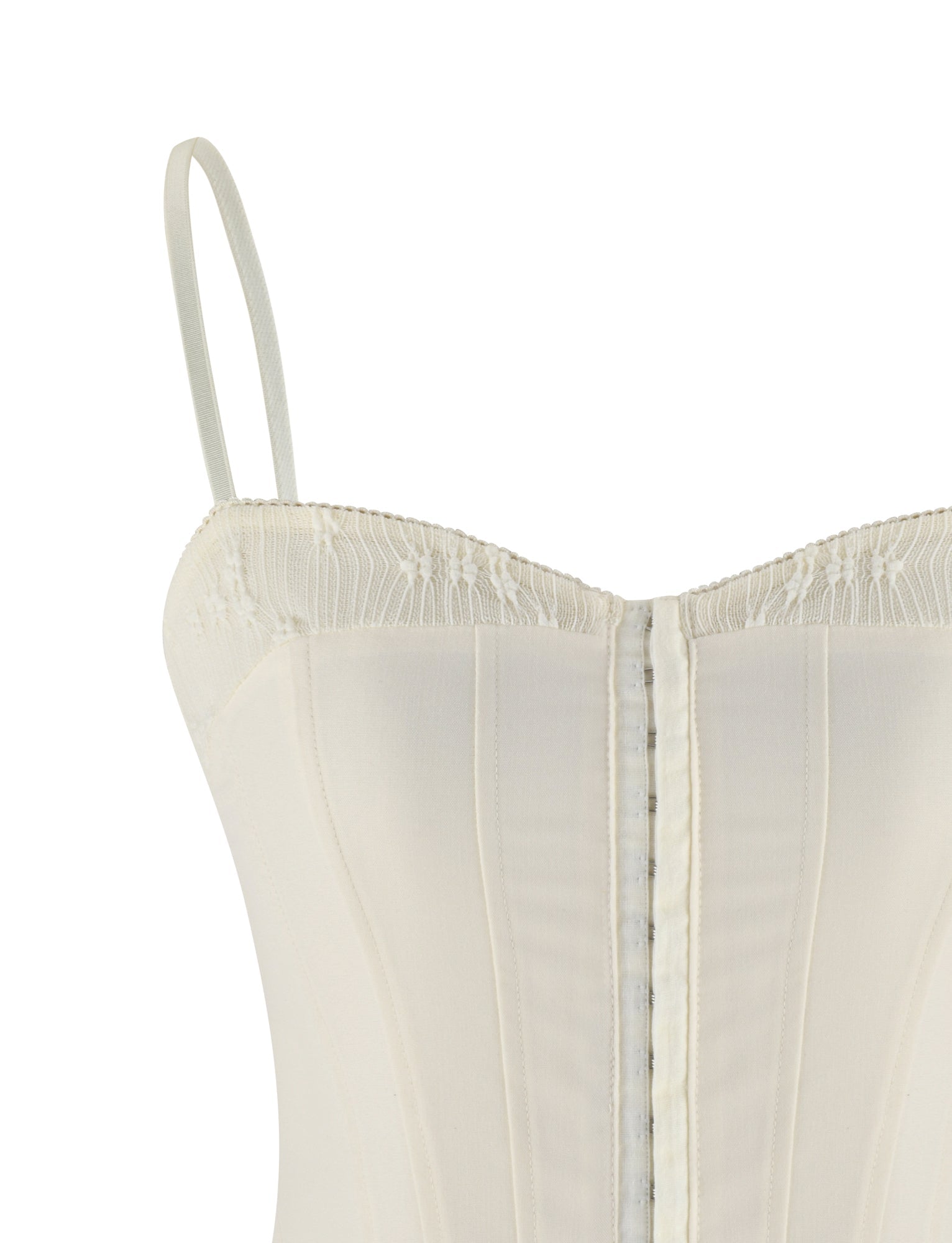 Close-up of the TIGERMIST ANTONELLA TOP in cream, featuring suiting fabric, adjustable straps, vertical boning, and lace trim along the top edge.