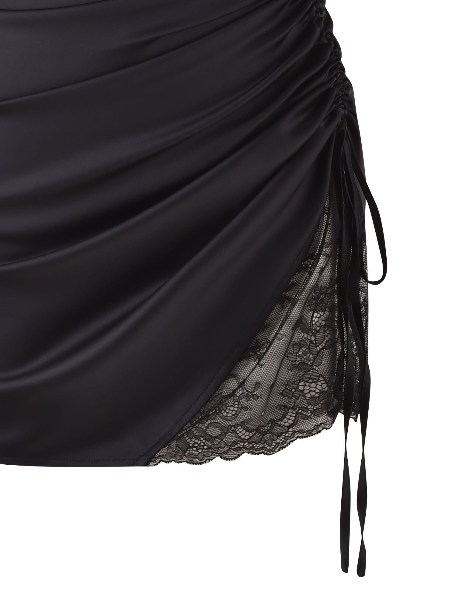 Close-up of the TIGERMIST BEXLEY MINI DRESS in black satin, showcasing ruched detailing, a side tie, and delicate black lace trim underneath.