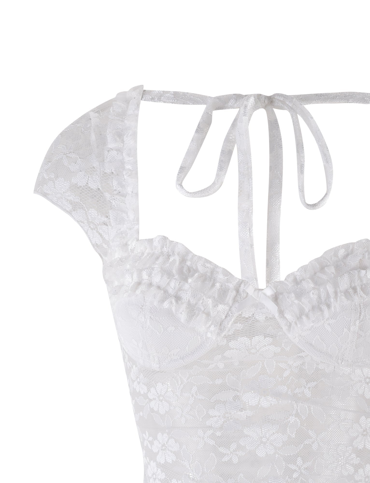 Close-up of the NYRA TOP in white by TIGERMIST, featuring semi-sheer lace fabric, ruffled edges, cap sleeves, floral patterns, and a tie at the back neckline.