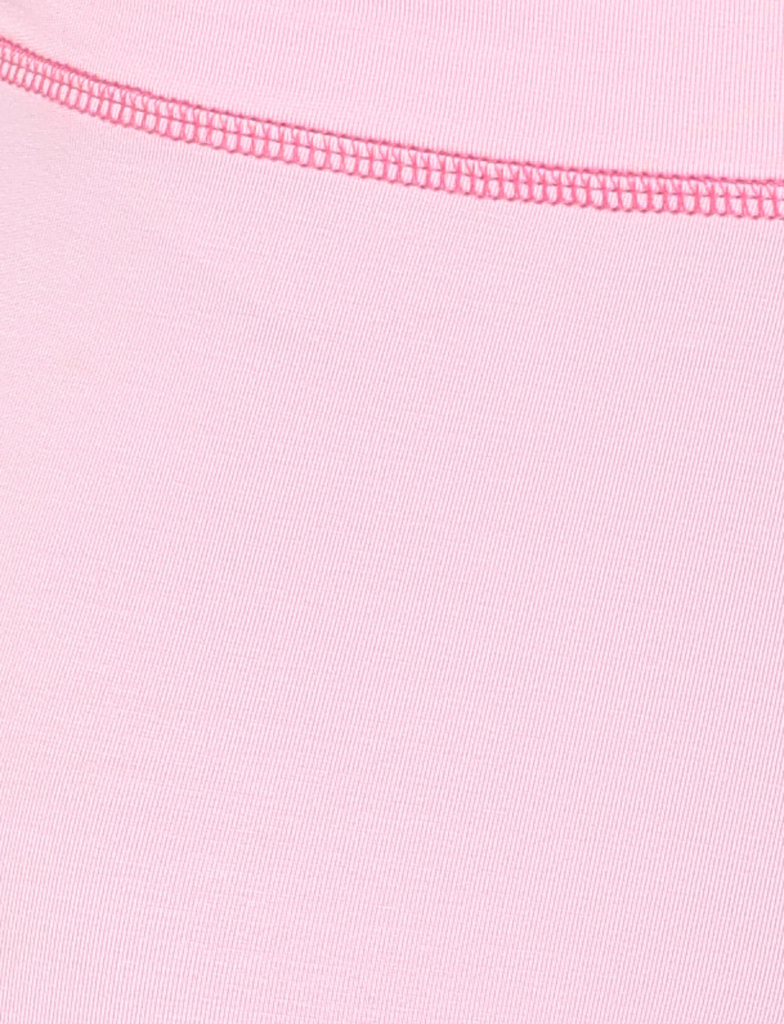 Close-up of the BLAYZE HOODIE - PINK by TIGERMIST, showing soft pink fabric with a visible diagonal texture and a curved seam stitched with darker pink thread across the top.