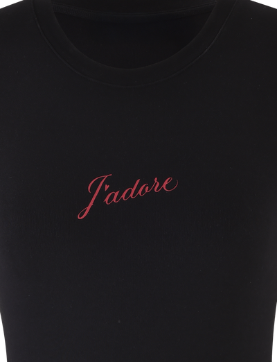 The SAPHIRA TEE - BLACK by TIGERMIST is a black standard tee with a J'Adore graphic embroidered in red cursive on the chest, crafted from high-stretch fabric for comfort and style.