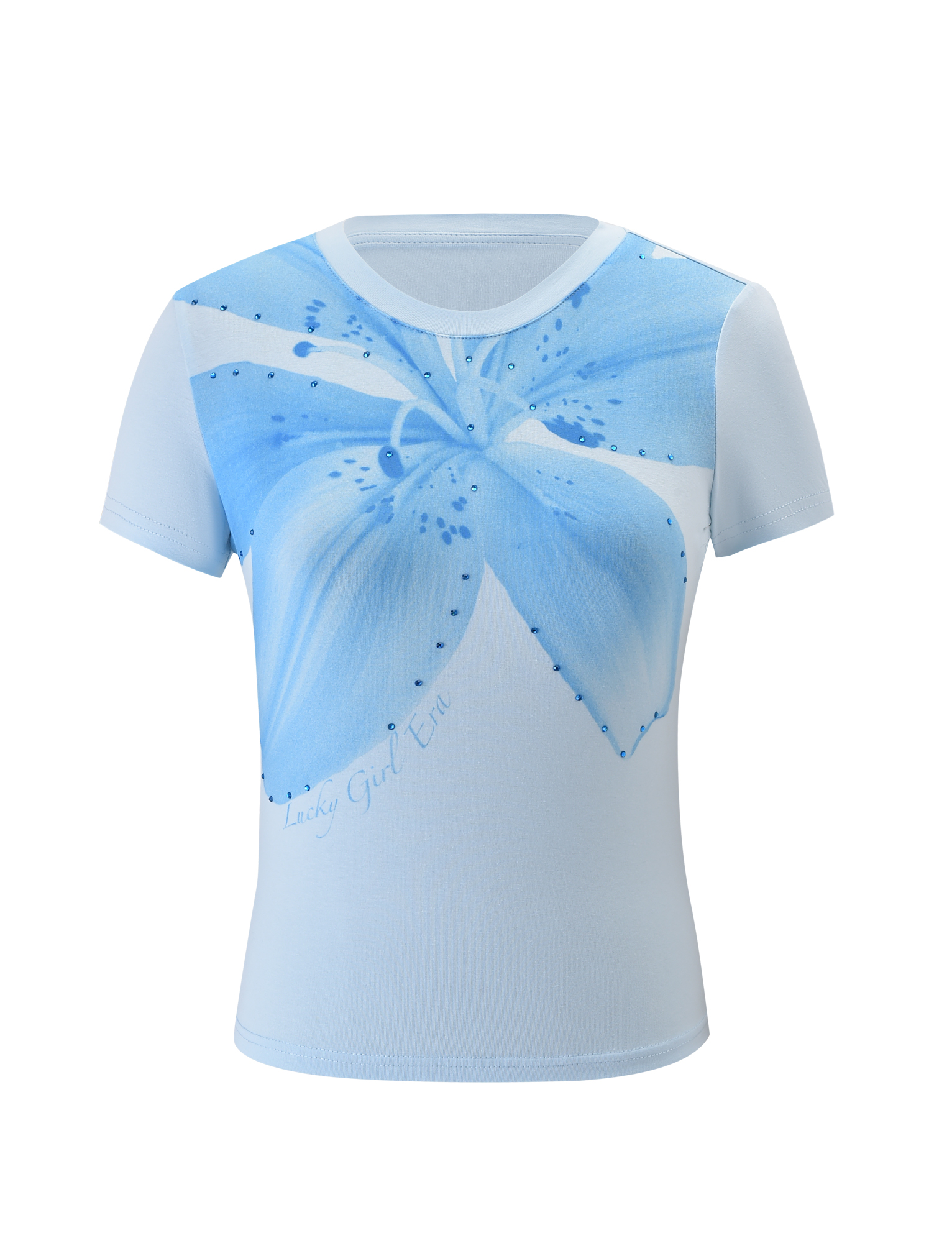 The TIGERMIST SAPHIRA TEE - BLUE features a detailed blue lily floral graphic on the chest, "Lucky Girl Era" in cursive near the hem, and subtle blue rhinestones for added sparkle.