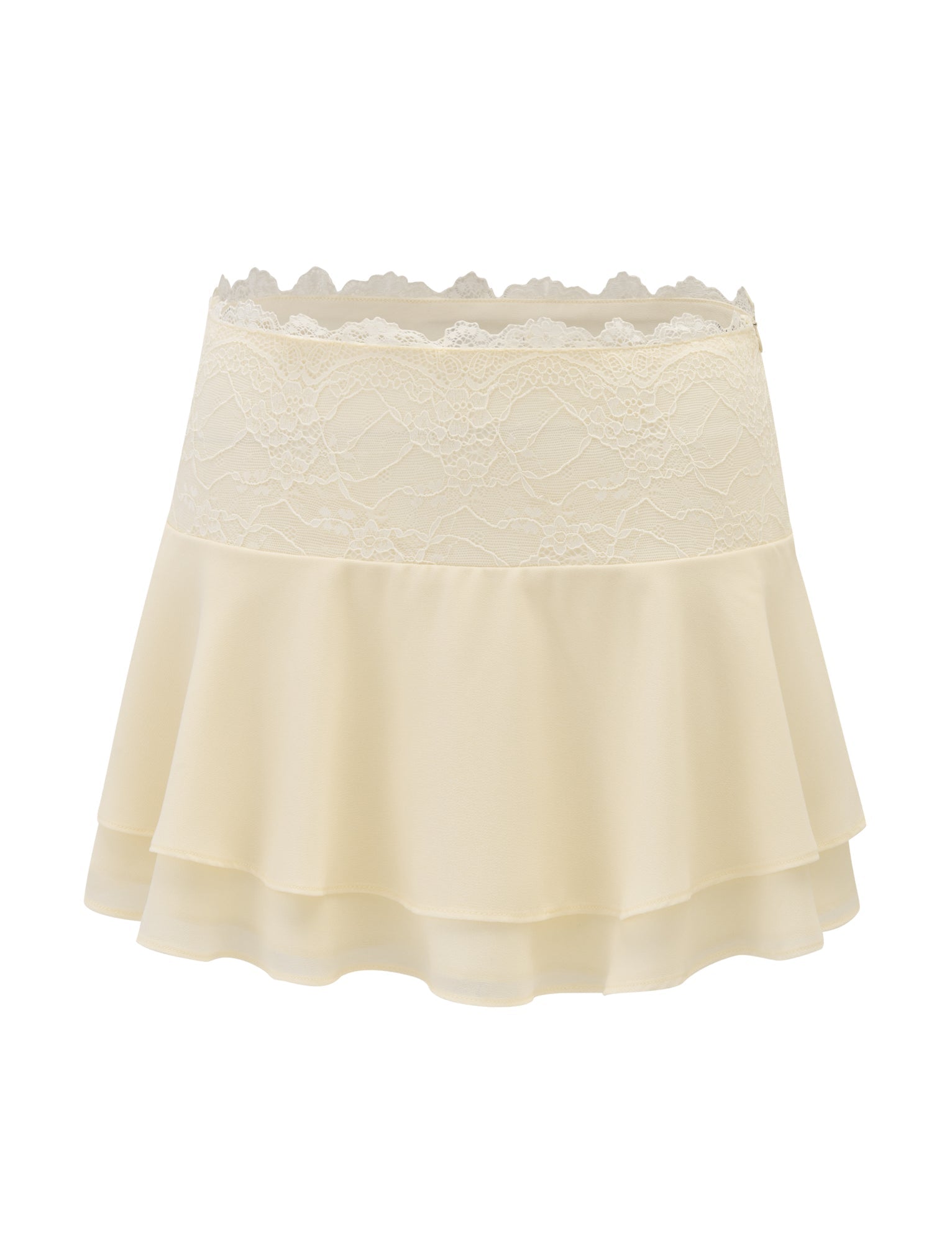 The INDIGO SKIRT - IVORY by TIGERMIST is a cream-colored mini skirt featuring a lace waistband, scalloped edge detailing, and a tiered, flared ruffle design made from soft, lightweight fabric.