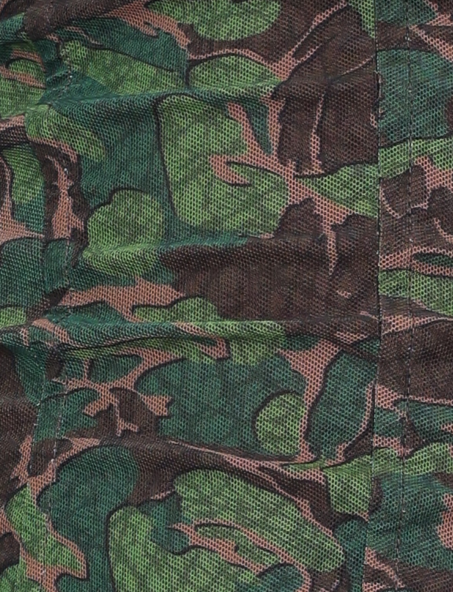 Close-up of the DULCE CORSET - GREEN : CAMO by TIGERMIST, featuring green camo print fabric with black stitching, a leafy pattern, and visible textured high-stretch material.