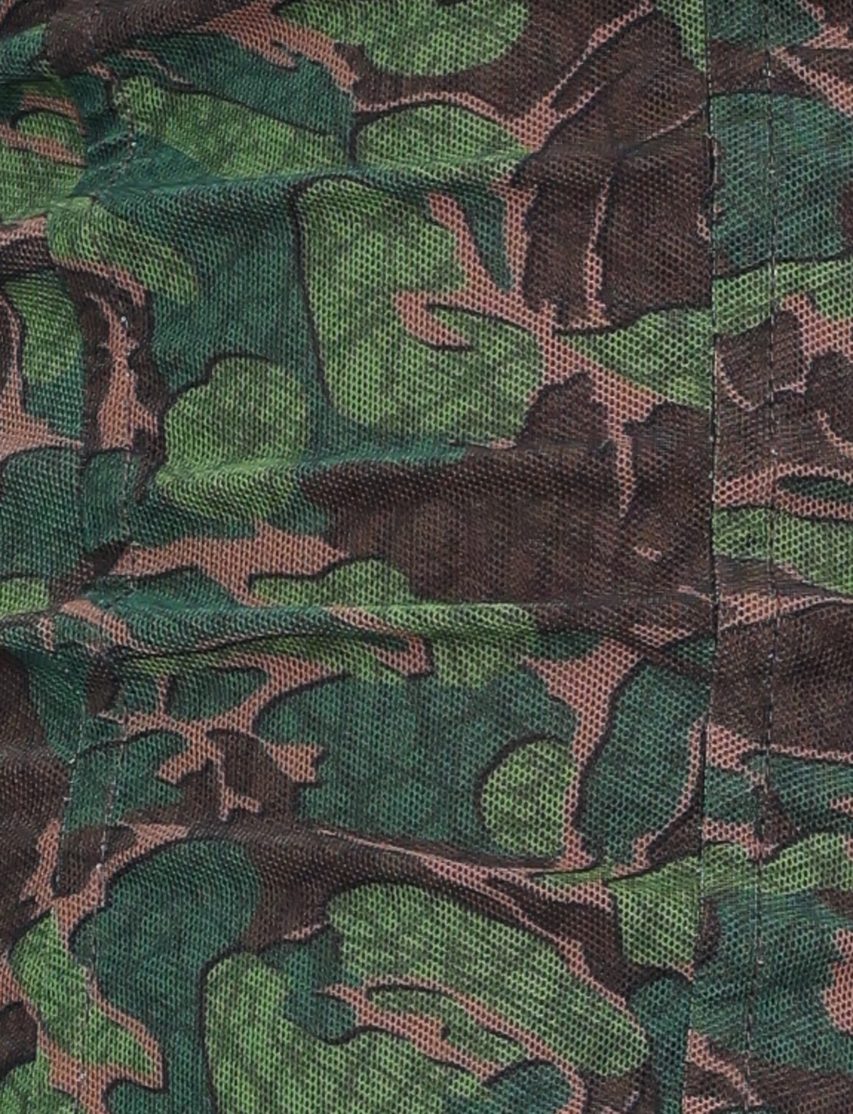 Close-up of the DULCE CORSET - GREEN : CAMO by TIGERMIST, featuring green camo print fabric with black stitching, a leafy pattern, and visible textured high-stretch material.