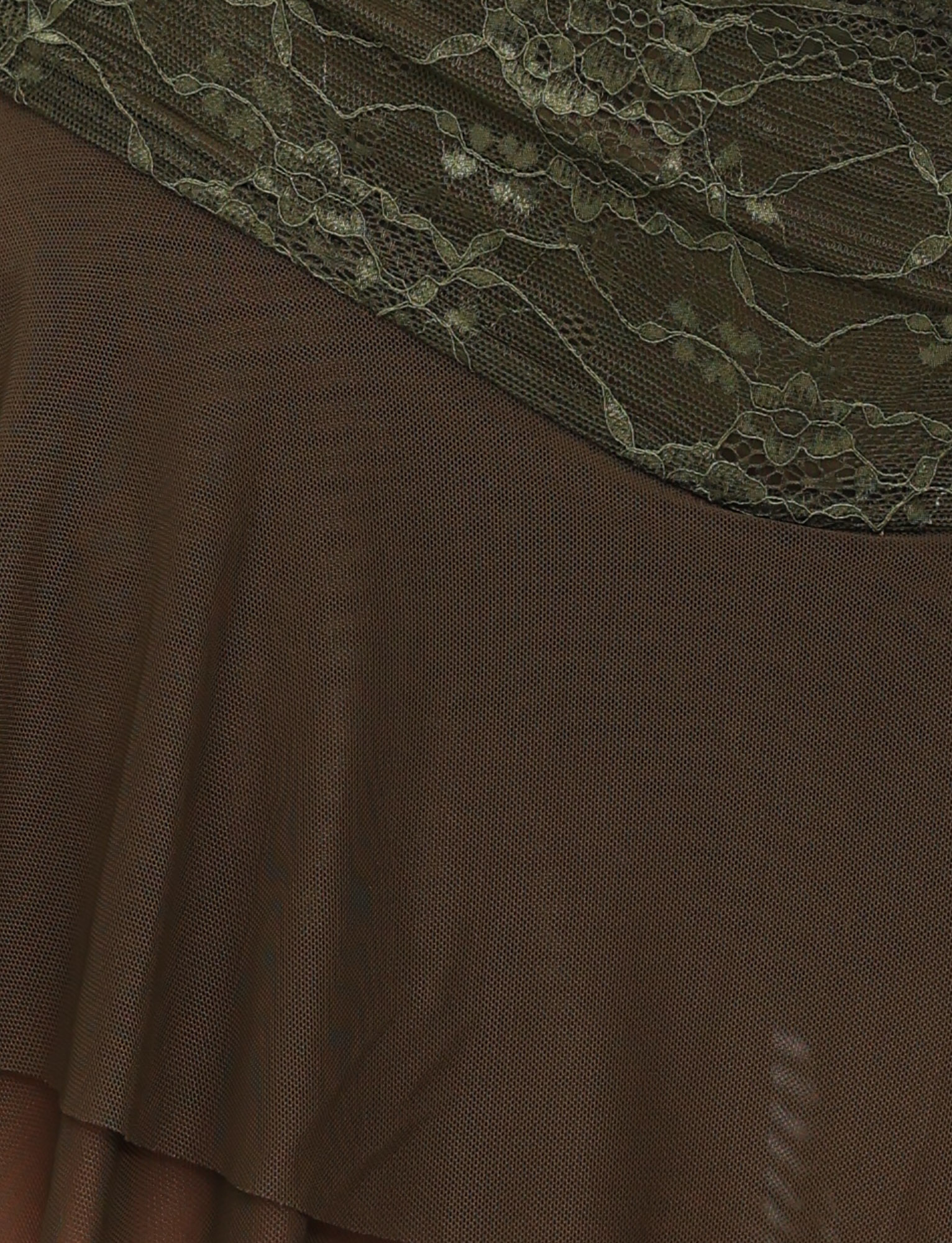 Close-up of the TIGERMIST ADELINA MINI SKIRT in khaki green, showing sheer brown fabric with a floral lace overlay and netting details at the top, highlighting its delicate drape and gentle folds.