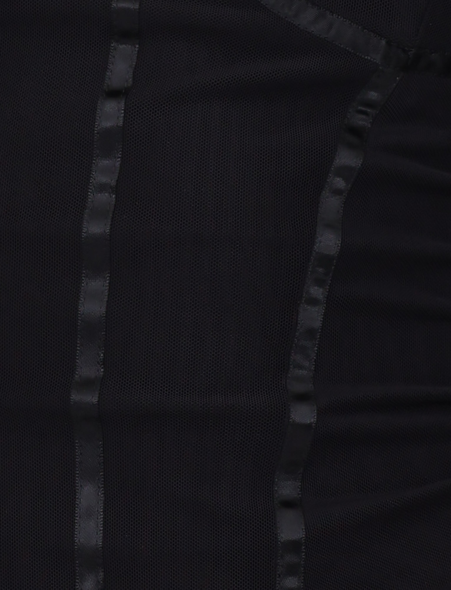 Close-up of the KAIRA CORSET TOP - BLACK by TIGERMIST, featuring vertical satin-like strips, a sheer textured mesh design, and adjustable shoulder straps for a customizable fit.