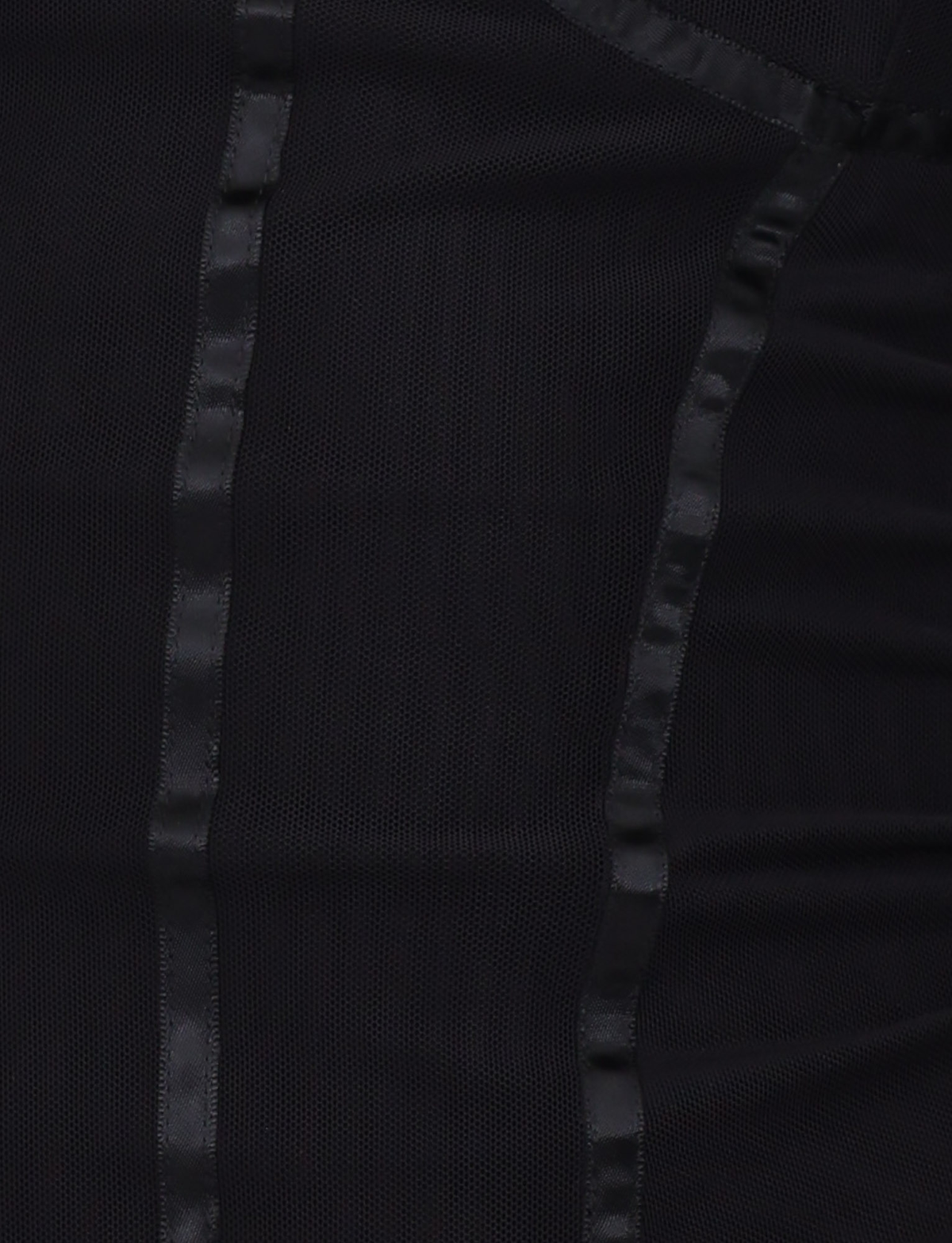 Close-up of the KAIRA CORSET TOP - BLACK by TIGERMIST, featuring vertical satin-like strips, a sheer textured mesh design, and adjustable shoulder straps for a customizable fit.