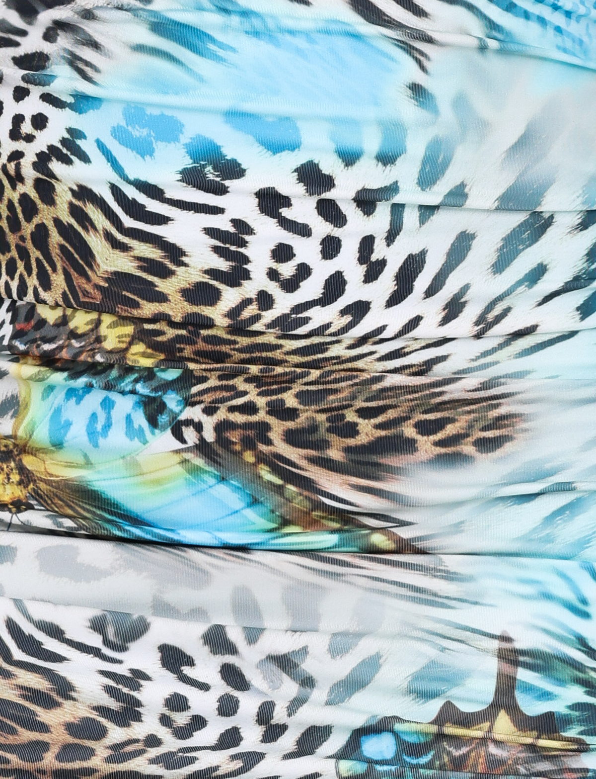 Close-up of the TIGERMIST FINLEA MINI SKIRT in Multi: Animal : Butterfly Animal, showcasing a vibrant A-line mini skirt with an animal print pattern featuring blue feathers, black spots, brown and yellow accents, turquoise streaks, and white details.