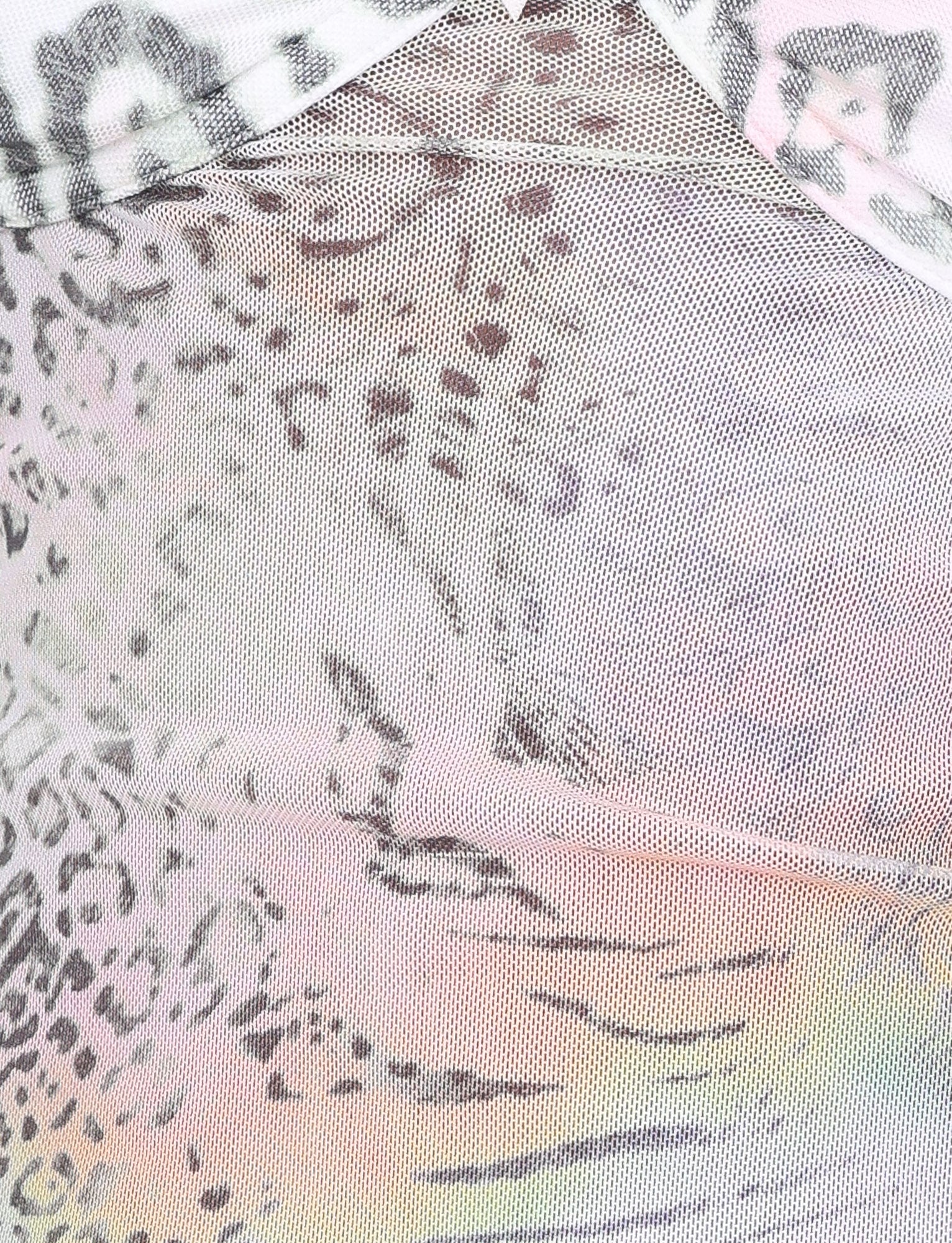 Close-up of the JOSEPHINE TOP in white with pastel animal print by TIGERMIST, featuring sheer, lightweight mesh fabric in pink, gray, and black tones with visible stitching and semi-transparent texture.