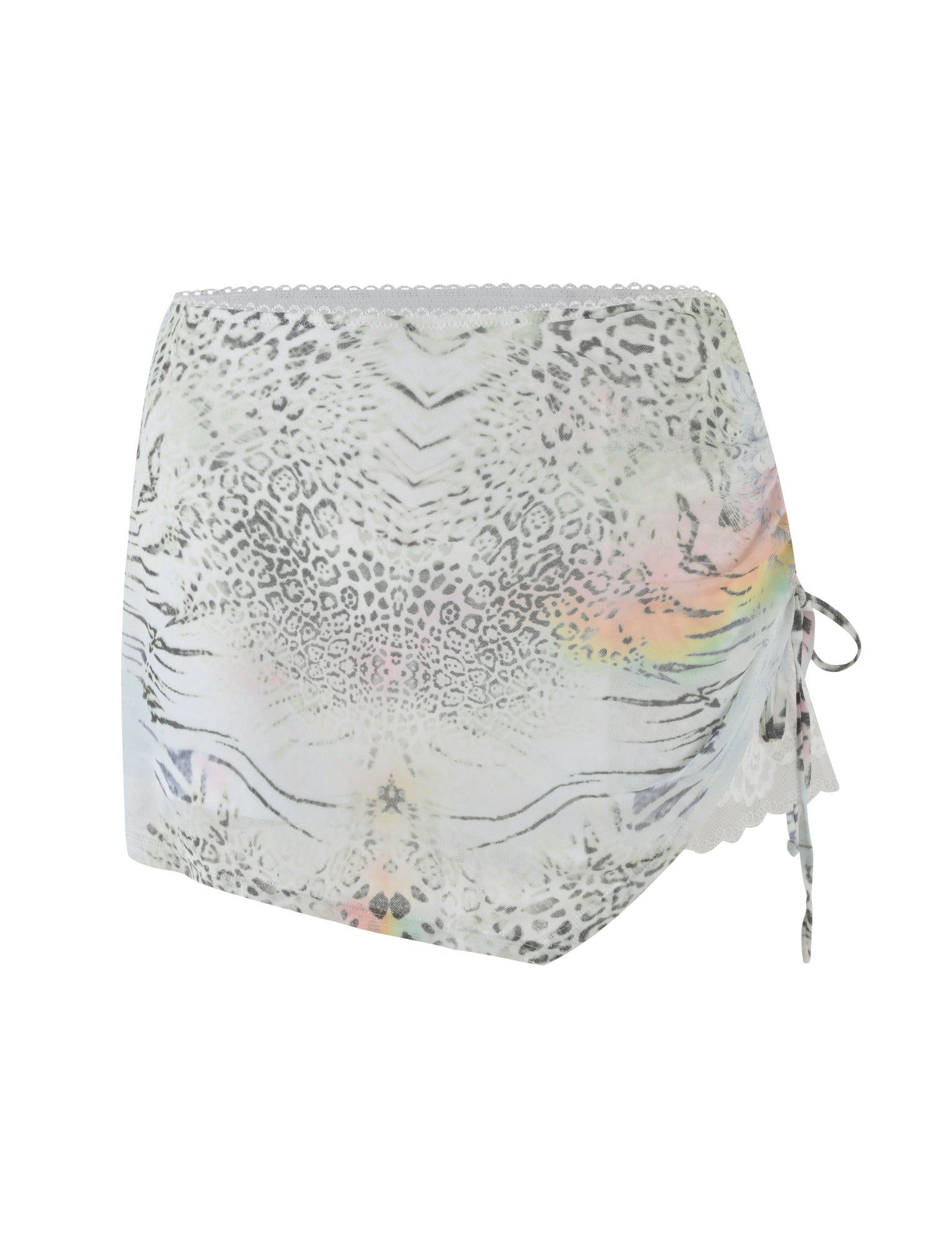 The JOSEPHINE MINI SKIRT by TIGERMIST features a white animal print design with light grey leopard spots, lace trim on both edges, and a side tie detail accented with subtle pastel rainbow hues.