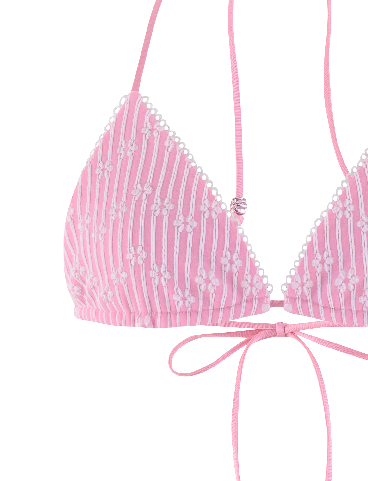 Close-up of the TIGERMIST SAHRA BIKINI TOP - PINK FLOWER STRIPE, featuring pink and white vertical stripes, delicate floral embroidery, thin straps, and a front bow tie.