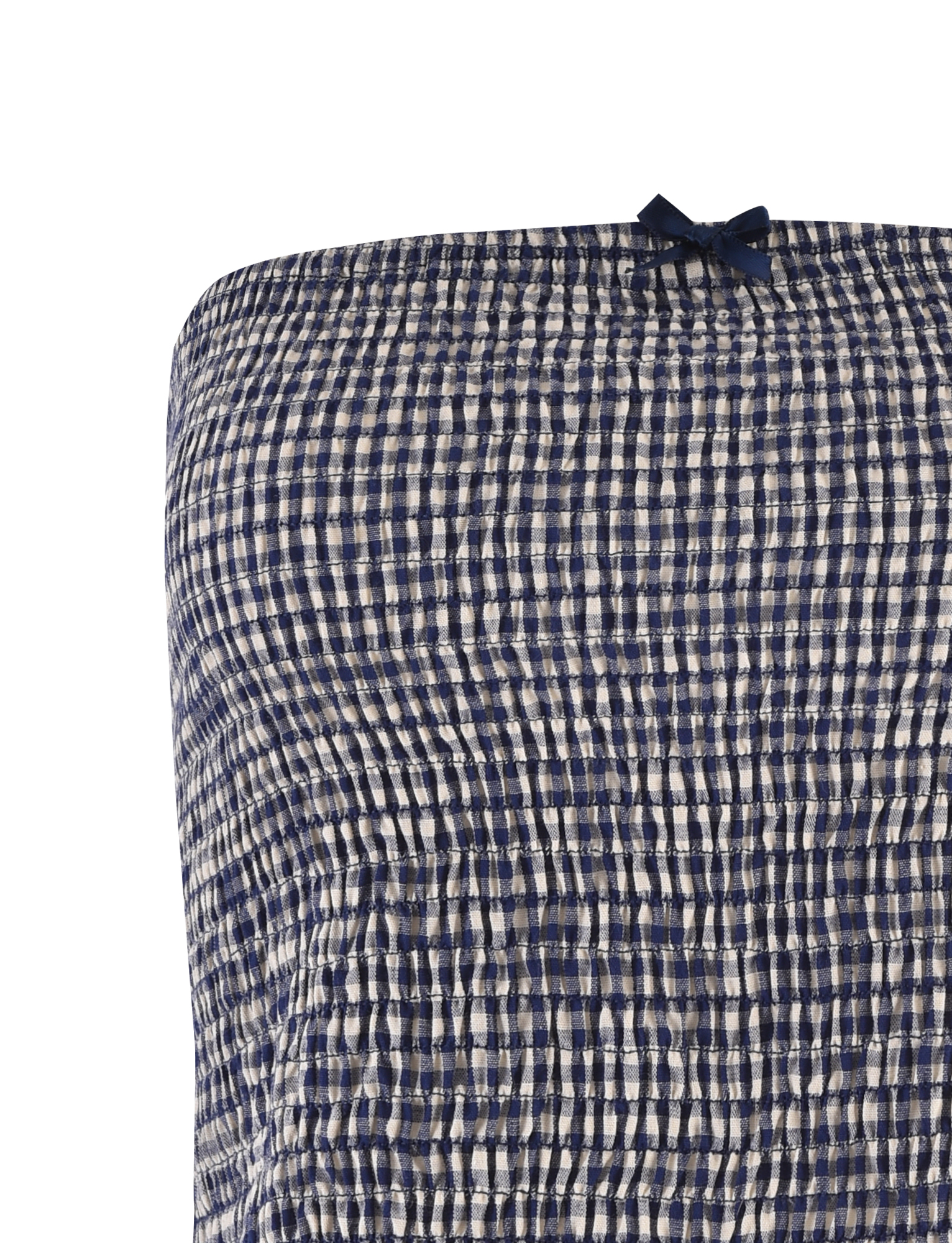 Close-up of the TIGERMIST ERYNN TOP - NAVY GINGHAM, featuring textured smocked navy and white checks and a small navy bow at the top center, accentuating this strapless top’s charming detail.
