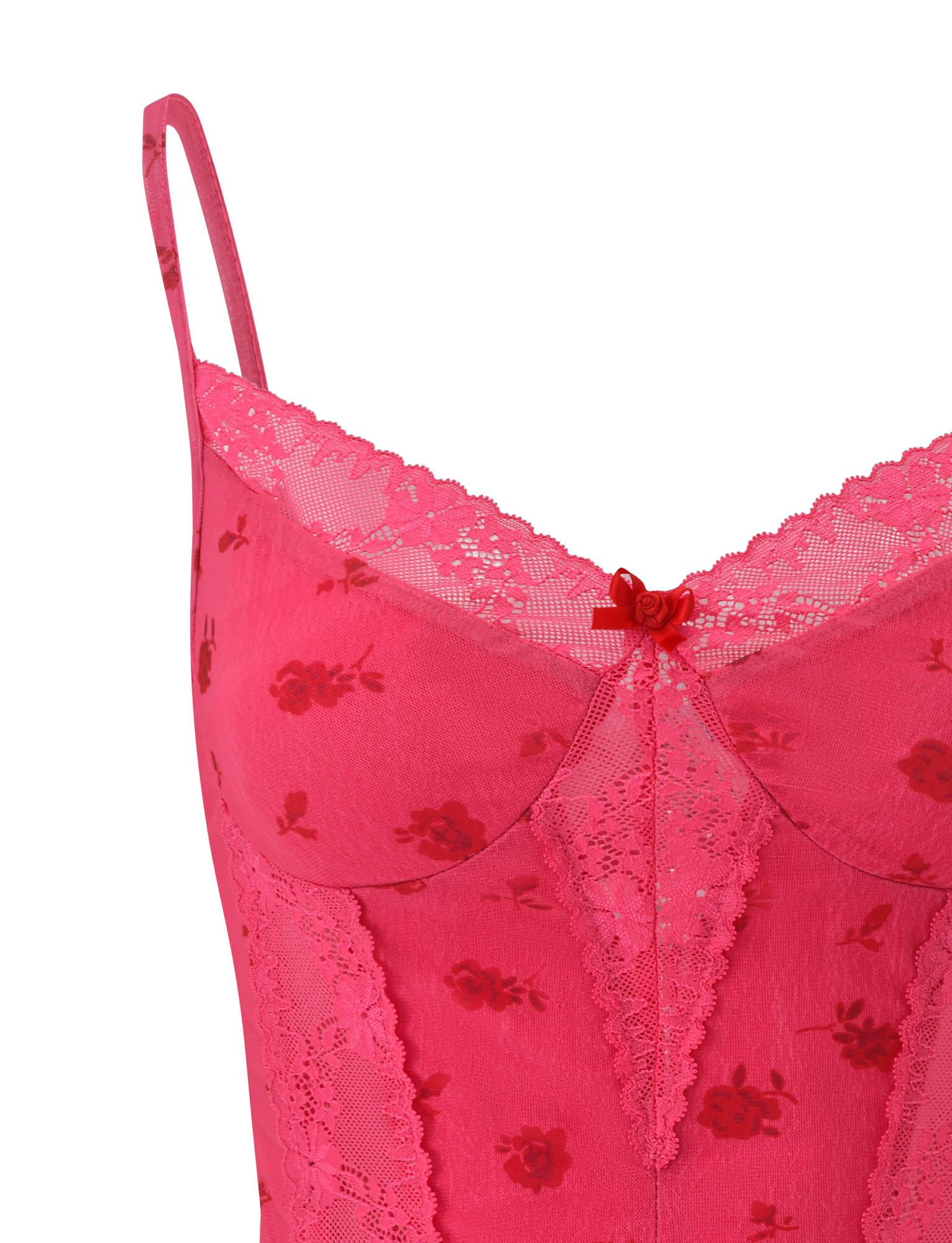 Close-up of the TIGERMIST KHALIA TOP - DITSY FLORAL, featuring a bright pink floral print, thin adjustable straps, delicate lace trim, and a small decorative bow at the neckline.
