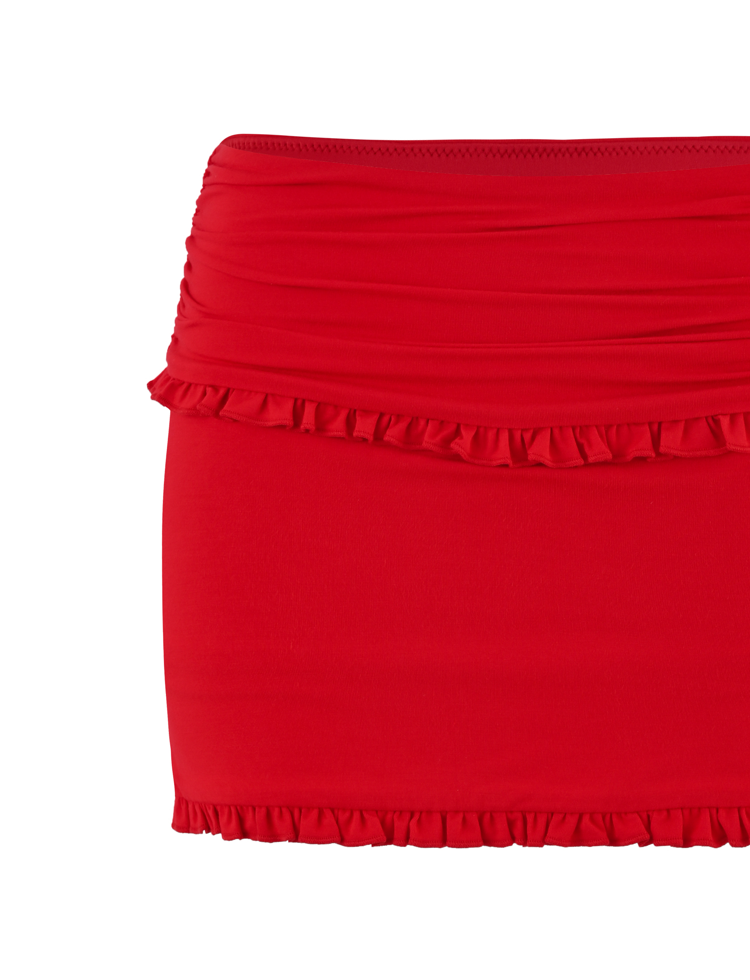 The TIGERMIST GINNY SKORT - RED is a bright red mini skort with ruffle accents on the top and bottom edges, featuring a bodycon fit and gathered fabric at the waistband.