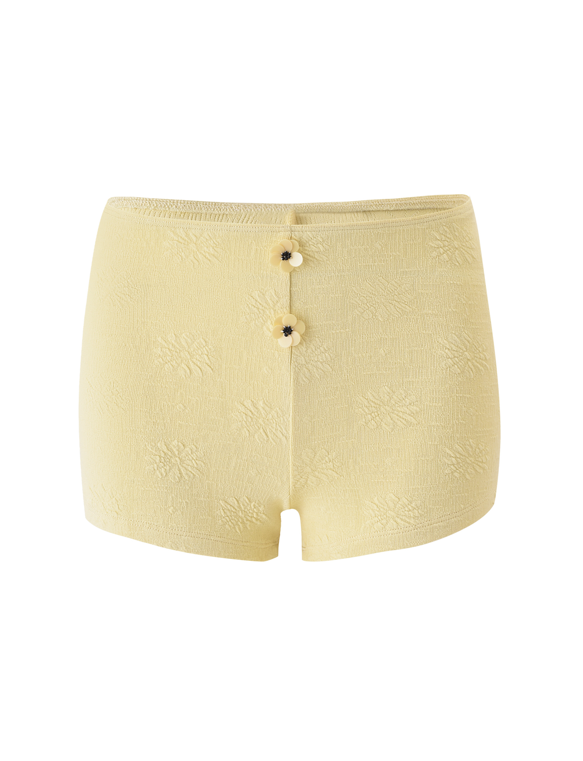 The TIGERMIST QUINLAN SHORT - LEMON features a high-waisted fit, light yellow hue, subtle floral texture, and two decorative front buttons, photographed against a plain white background.