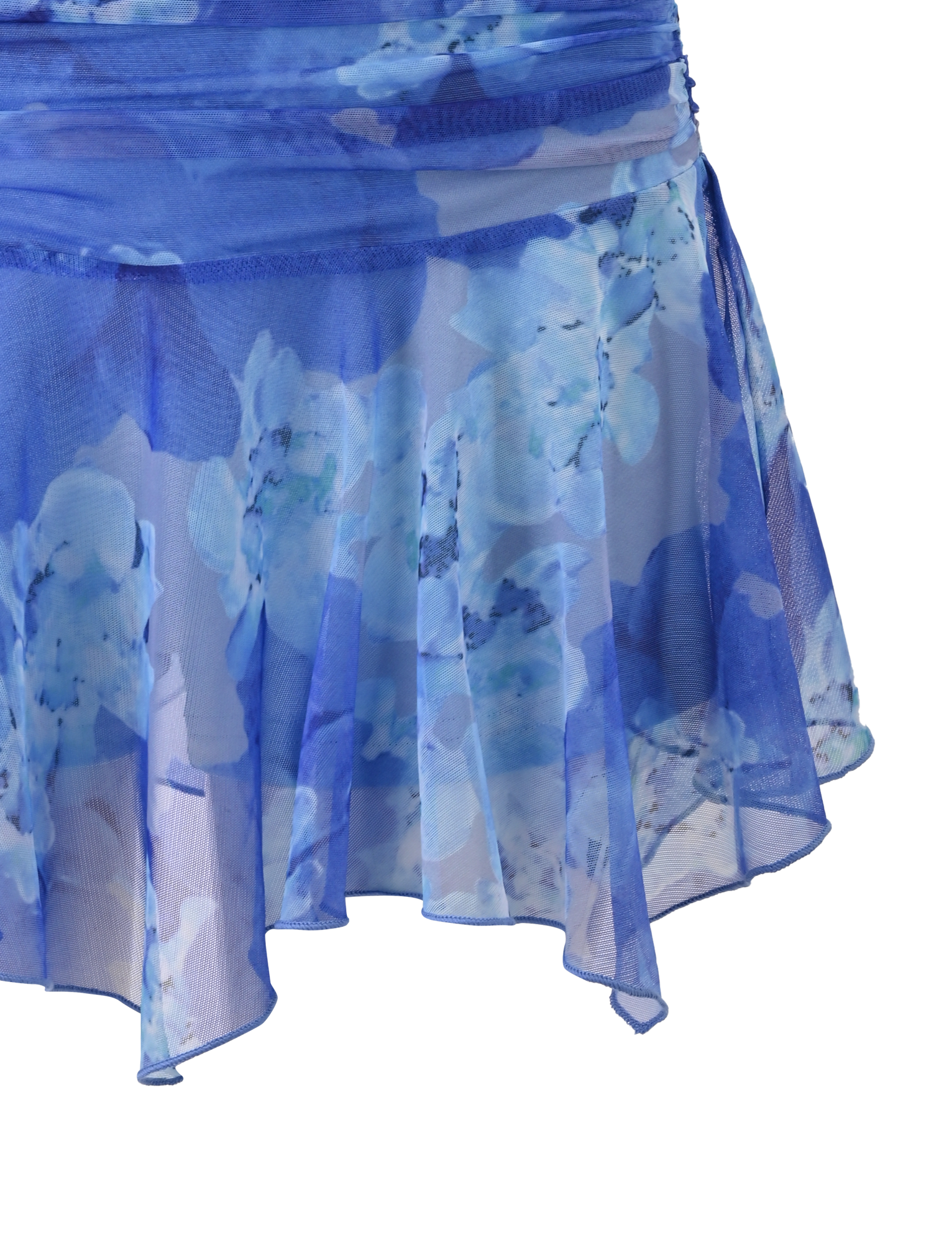 A close-up of the DEVYN MINI SKORT - BLUE MACRO FLORAL by TIGERMIST, featuring sheer, flowy fabric, an asymmetrical hemline, and a mid rise fit with light blue and white floral patterns for a fresh look.
