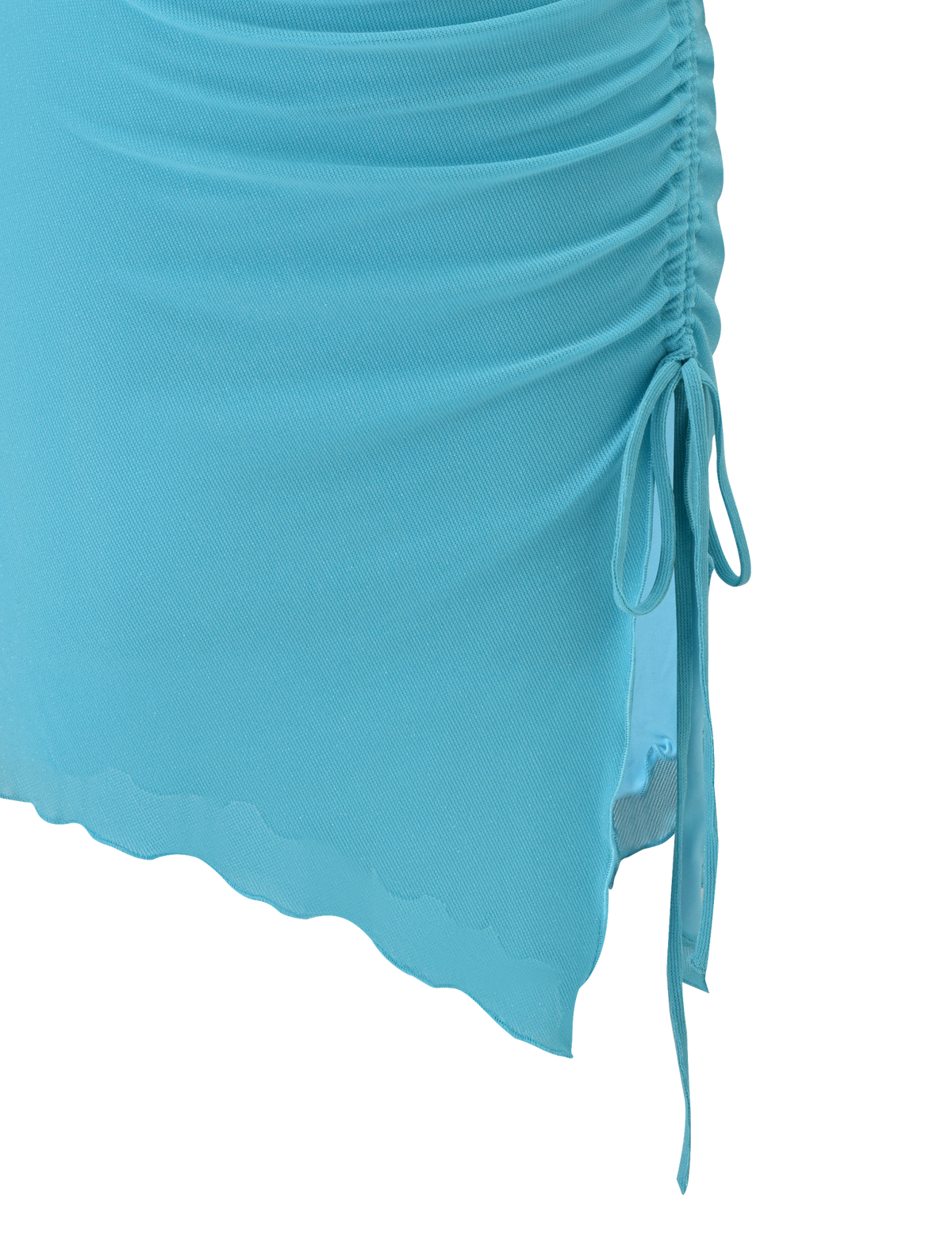A close-up of TIGERMIST's ELWYN MINI DRESS in blue, featuring light blue ruched fabric, a side drawstring tie, and a wavy asymmetrical hemline.