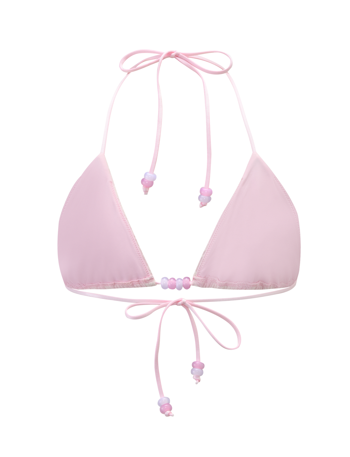 The BRIGITTE BIKINI TOP - IVORY LACE by TIGERMIST is a light pink triangle bikini top with adjustable halter neck and back ties, adorned with small pastel beads for a playful, chic touch.