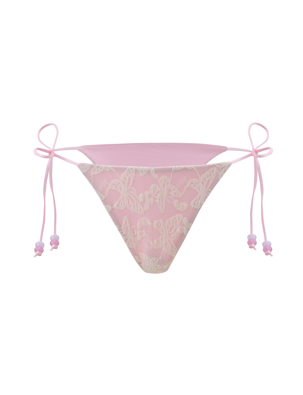 The BRIGITTE BIKINI BOTTOM - IVORY LACE by TIGERMIST features delicate light pink lace with white bow patterns and thin side ties, each tied into a small bow.