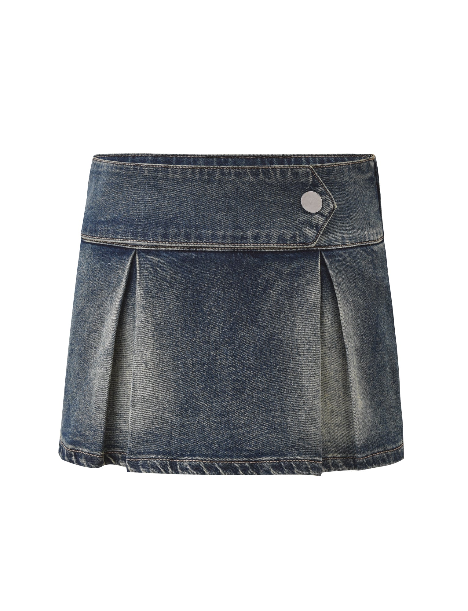 The TIGERMIST LUPITA SKORT - MID WASH is a pleated denim mini skort with a wide waistband, diagonal front panel secured by a silver button, vintage faded wash, and in-built shorts for added comfort and coverage.