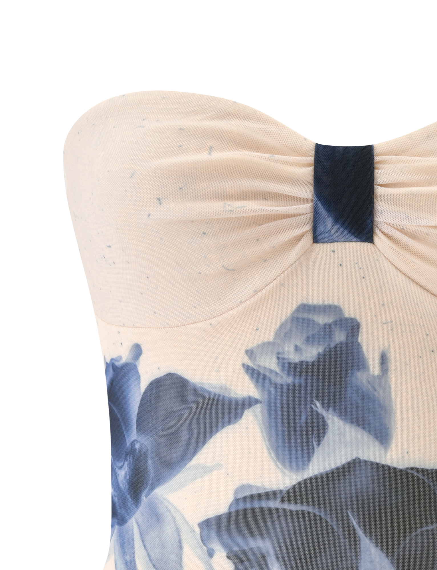 A close-up of the TIGERMIST JANIS TOP in indigo floral, a strapless cream tube top with blue rose print and a gathered, knotted center detail.