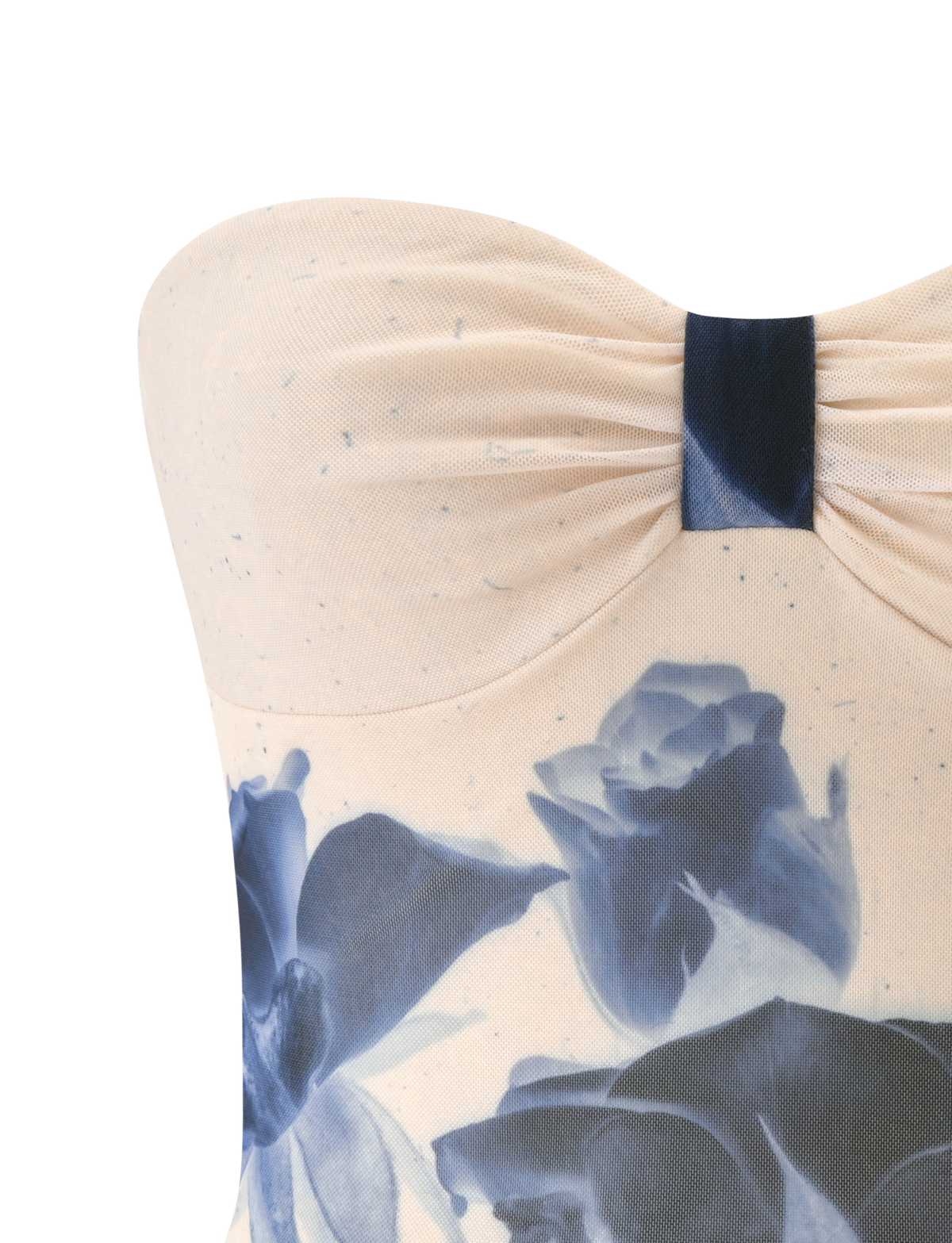 A close-up of the TIGERMIST JANIS TOP in indigo floral, a strapless cream tube top with blue rose print and a gathered, knotted center detail.