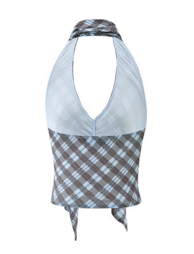 The NOBLE TOP - BLUE CHECK by TIGERMIST is a sleeveless halter top with a deep plunge neckline, brown and blue check pattern, tie-back design, and mesh-textured upper for added style.