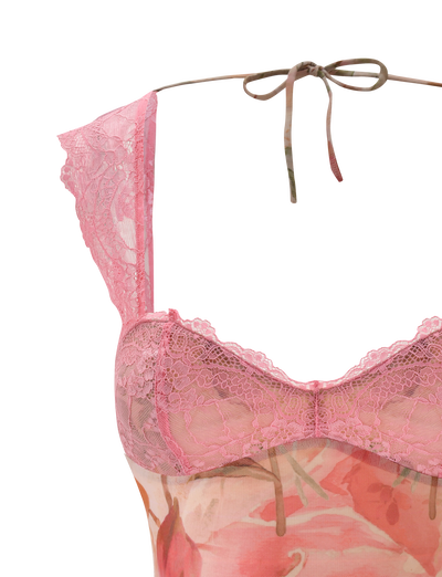 A close-up of the TIGERMIST DUNE TOP - WATERCOLOUR FLORAL, featuring a pink lace-trimmed sheer design with cap sleeves and an adjustable tie back, displayed on a white background.