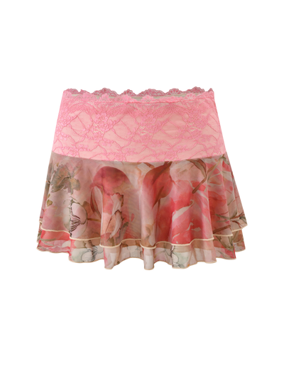 The DUNE MESH MINI SKIRT by TIGERMIST features a pink lace waistband, tiered mesh ruffle, and a sheer watercolour floral design with delicate pink and cream flowers for a feminine, elegant look.
