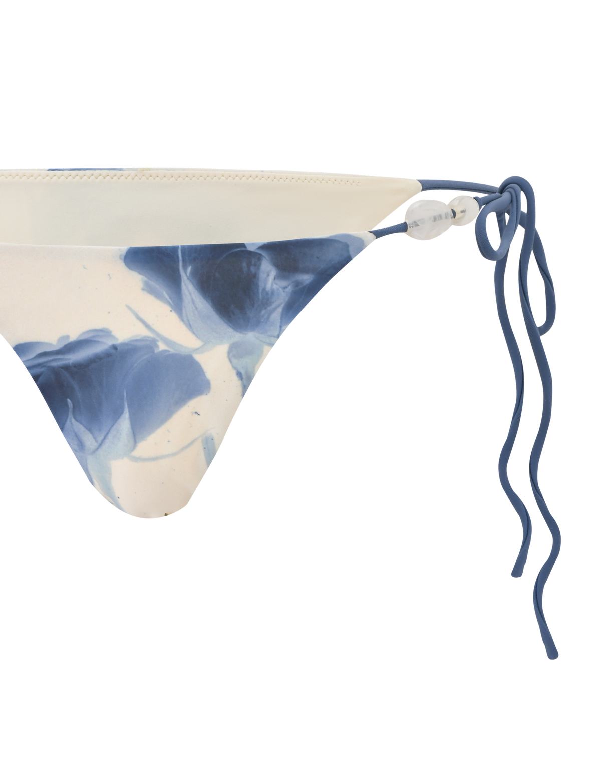 A close-up of the TIGERMIST CYLAS BIKINI BOTTOM in Indigo Floral, featuring blue and white rose print on the left side, set against a white background.
