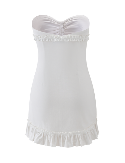 The KITTIE STRAPLESS DRESS - WHITE by TIGERMIST features a ruched top, cinched silhouette for a flattering fit, and ruffled trim at the neckline and hem, displayed on a plain white background.