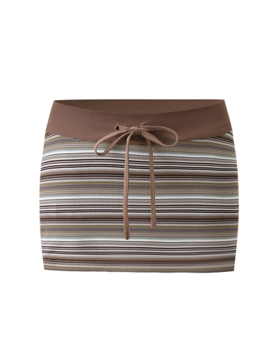 The KAYDIN SKORT - MULTISTRIPE by TIGERMIST is a rib knit bodycon micro mini skort featuring horizontal brown, beige, and white stripes, a solid brown waistband with front tie drawstring, and hidden shorts for comfort.