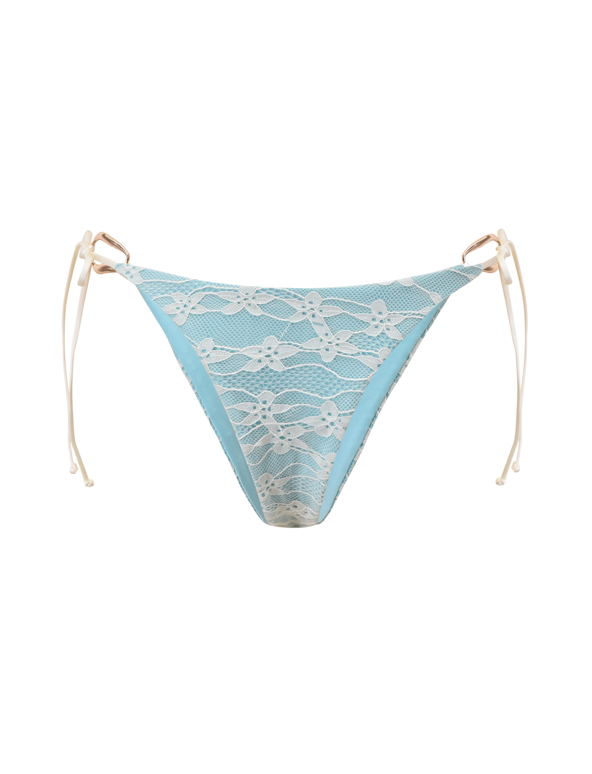 The SIKA BIKINI BOTTOM - BLUE LACE by TIGERMIST features aqua blue bikini bottoms with a white lace overlay, beige adjustable side ties, and a cheeky cut, shown on a plain white background.