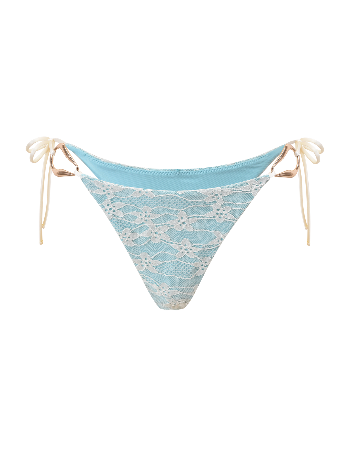 The SIKA BIKINI BOTTOM - BLUE LACE by TIGERMIST features a light blue design with white floral lace and light beige side ties, shown on a plain white background for a fresh, stylish appeal.