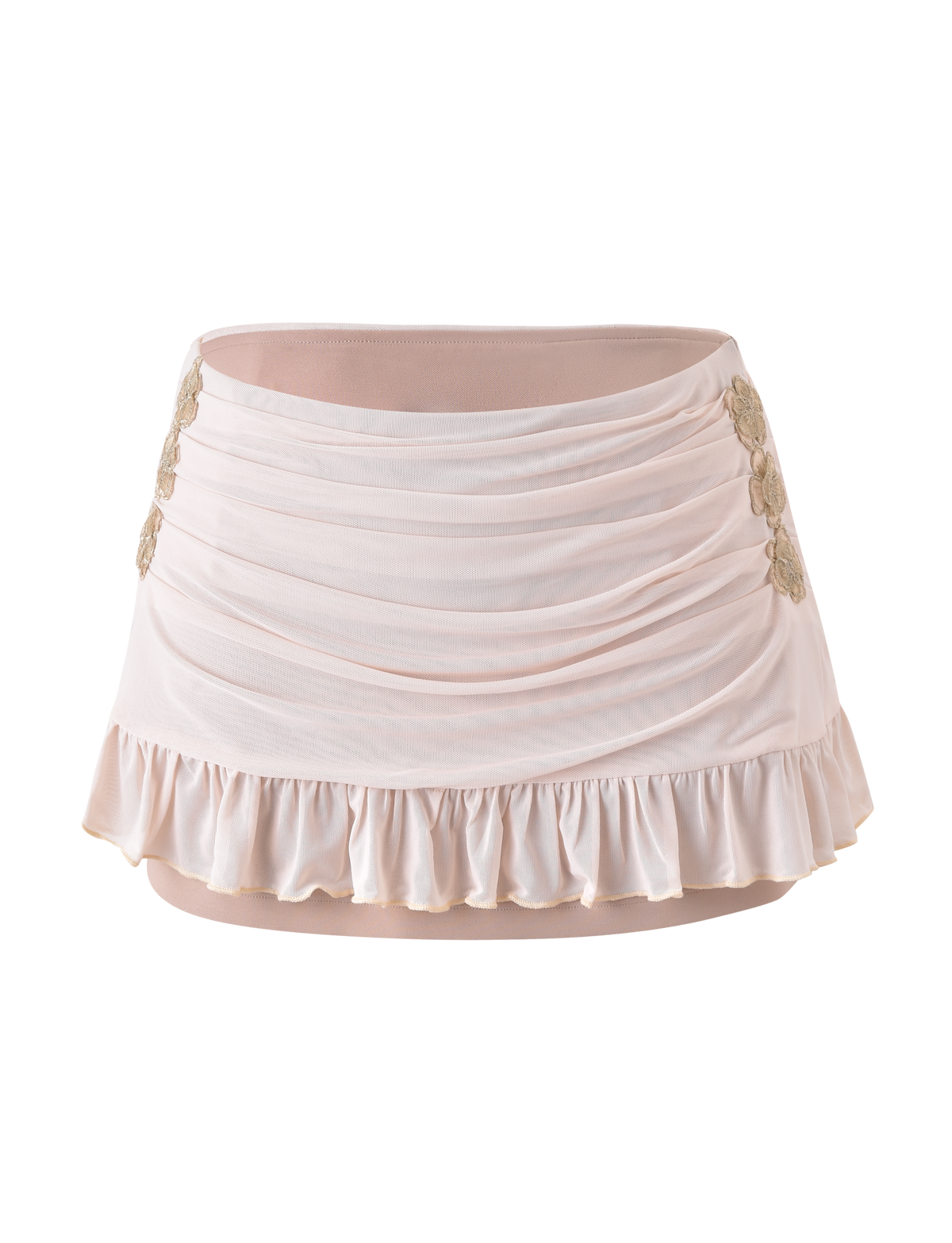 The TIGERMIST TERESE FLORAL APPLIQUE SKIRT in tan is a ruched mini skirt with ruffled hem, metallic gold floral appliques on the sides, and delicate embroidery accents, shown against a plain white background.
