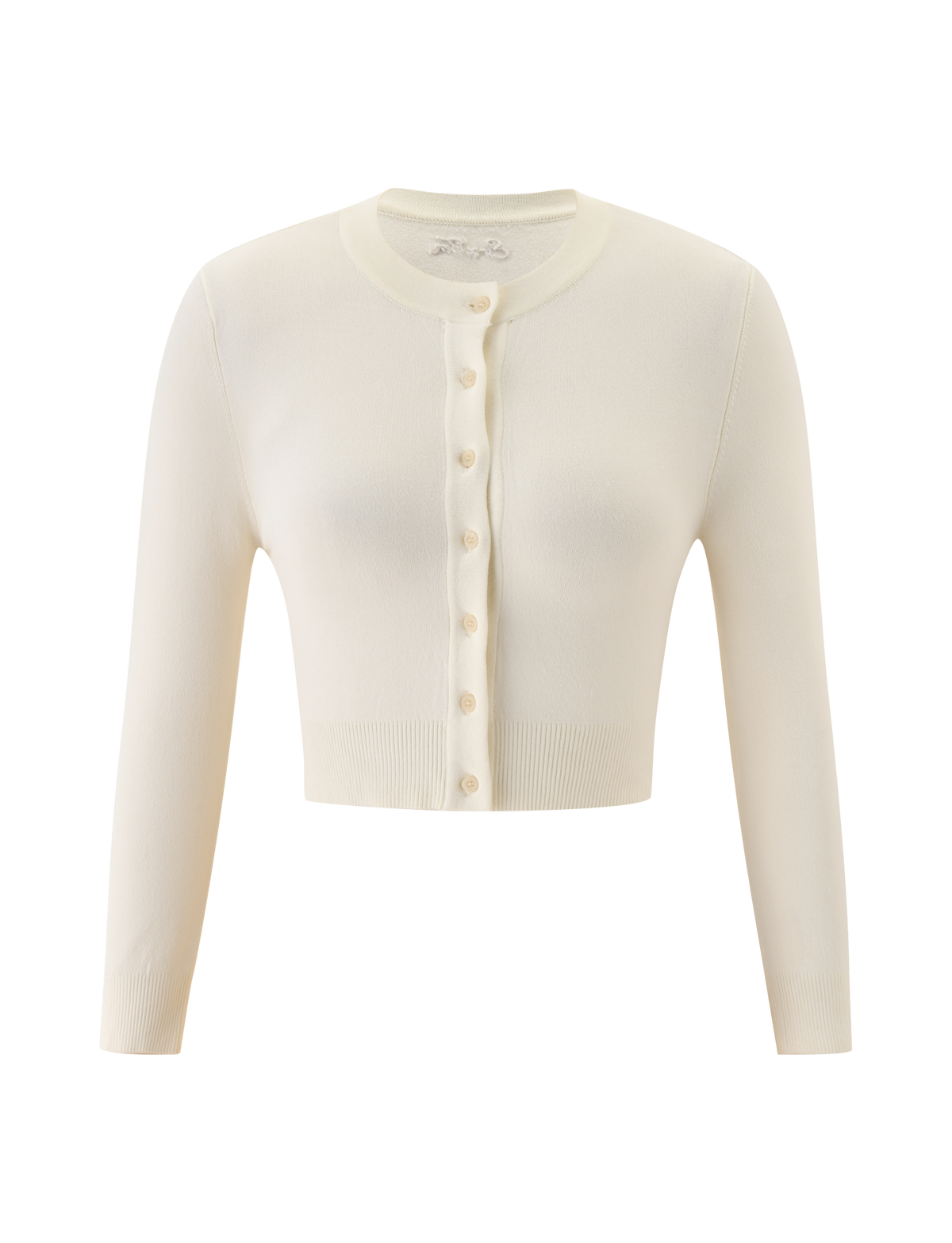 The DAMARIS CARDIGAN by TIGERMIST is a cream button-up knit with a cropped silhouette, long sleeves, round neckline, and semi-sheer finish, shown on a plain white background.