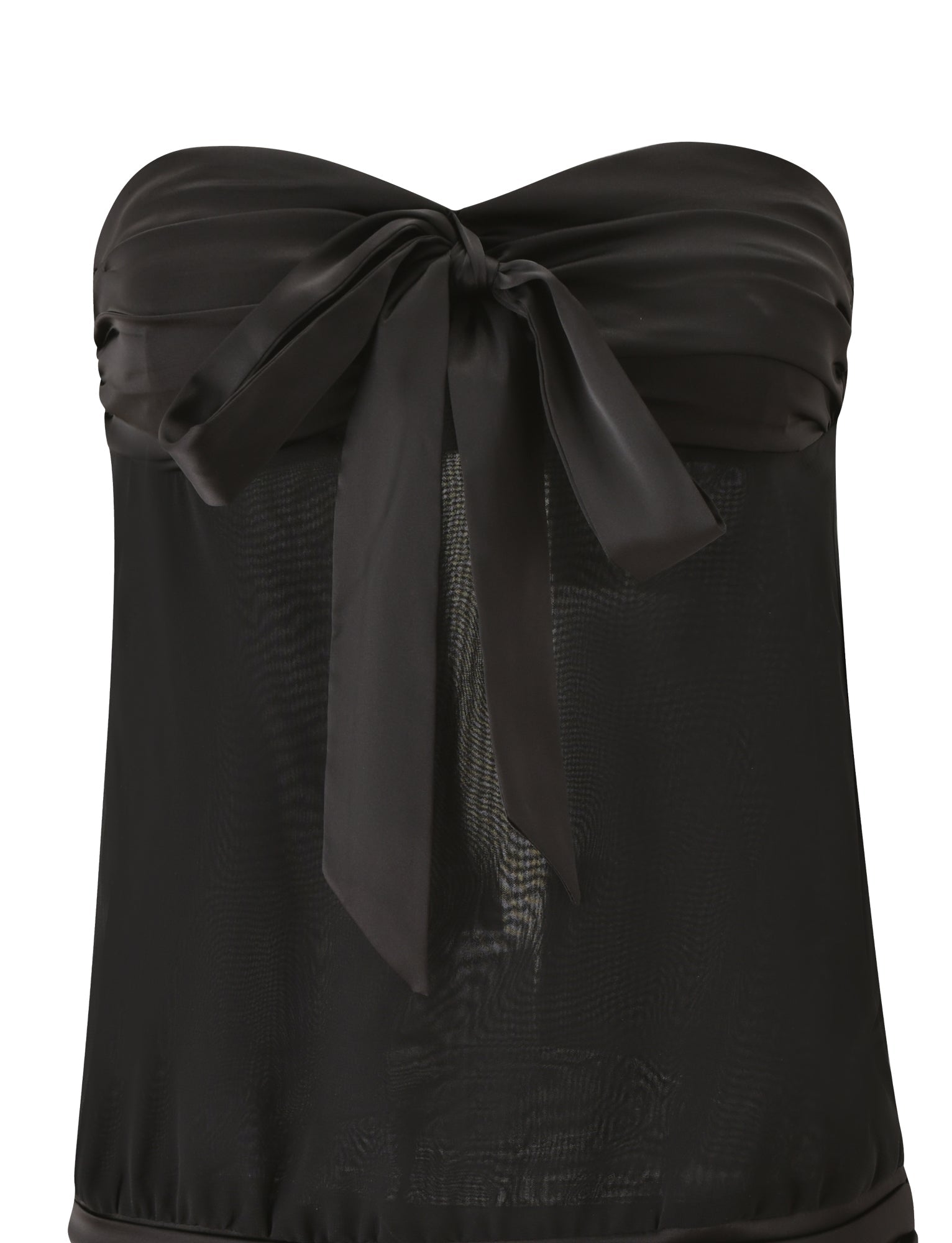 The LUX MINI DRESS – BLACK by TIGERMIST is a strapless black mini dress with a sheer mesh body and a satin bow at the bust, reminiscent of a little black dress, displayed against a white background.