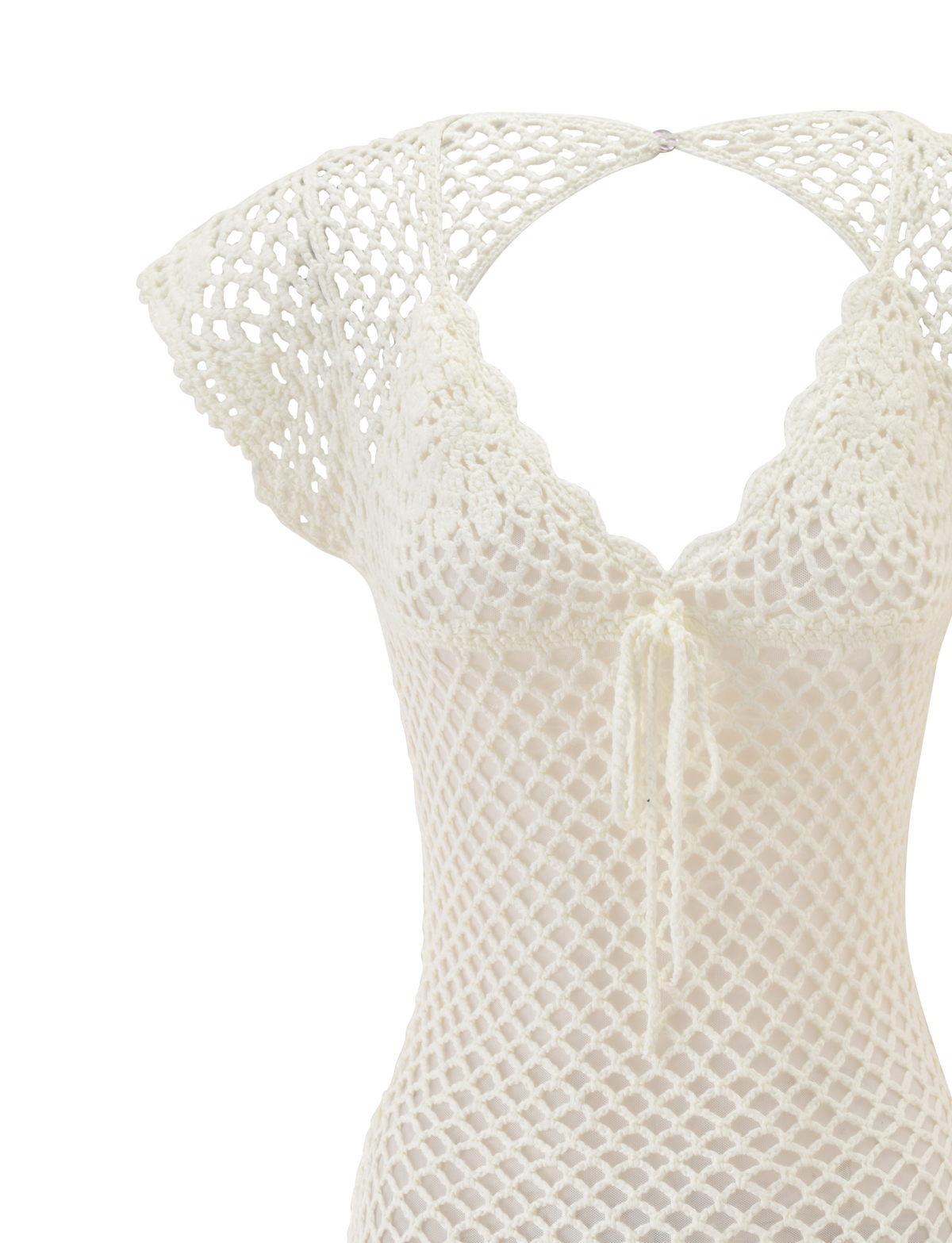 A close-up of the TIGERMIST SASHA CROCHET MINI DRESS in white, featuring cap sleeves, a V-neckline, scalloped edges, and a front tie—ideal as a chic swim cover-up or vacation dress—displayed on a plain white background.